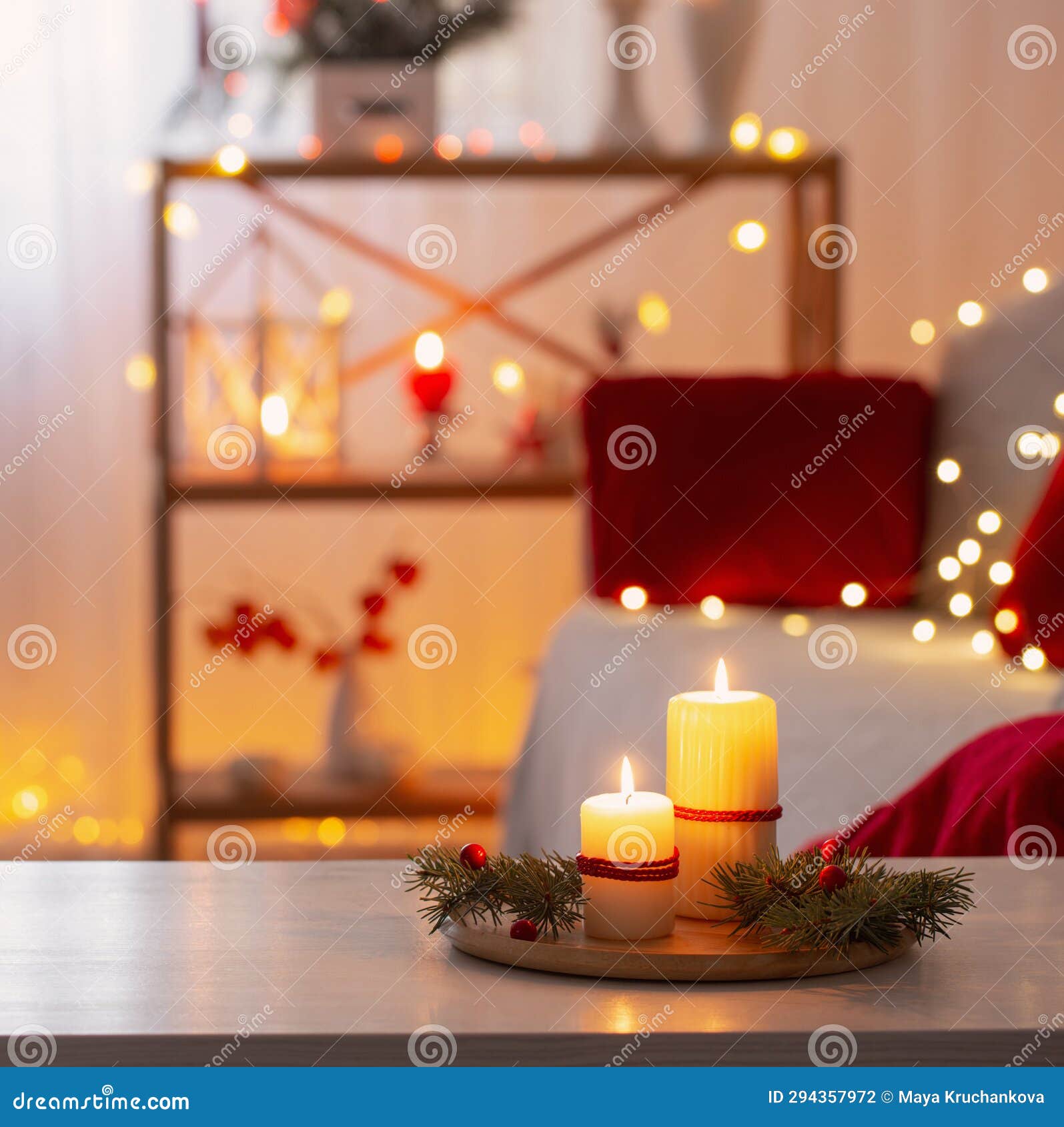 Christmas Decor in Red Color with Burning Candles at Home Stock Photo