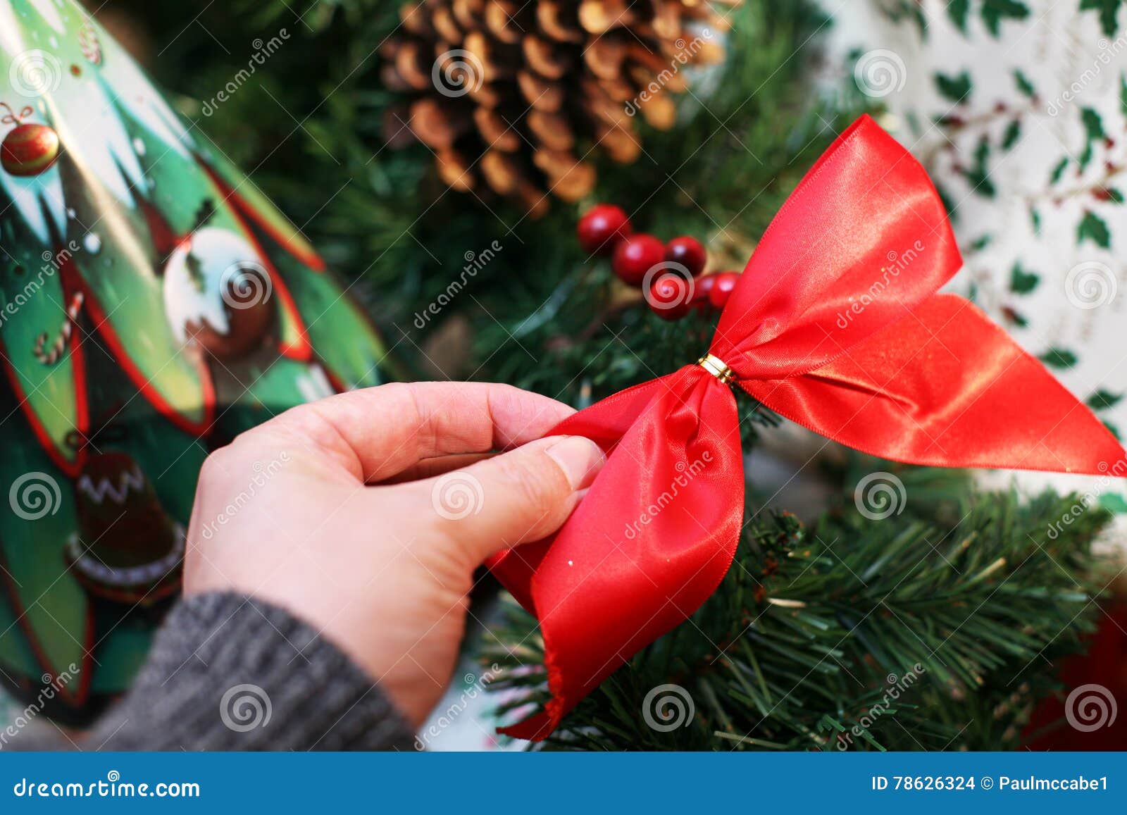 Christmas Decorating with Red Bow Stock Photo Image of holiday, santas 78626324