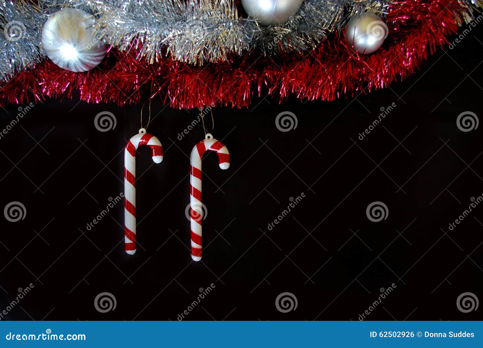 Christmas Decoration Composition Tinsel Candy Canes and Baubles Stock