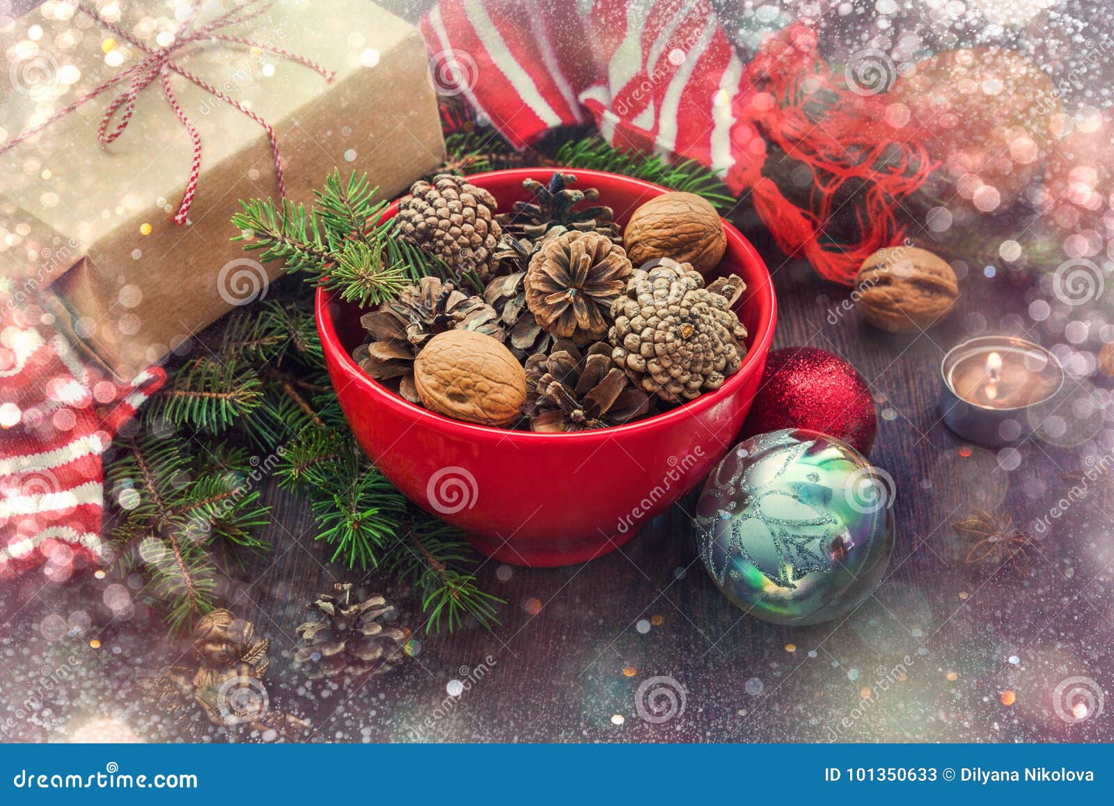 Christmas branches, cones, decorations on parchment paper. Holiday