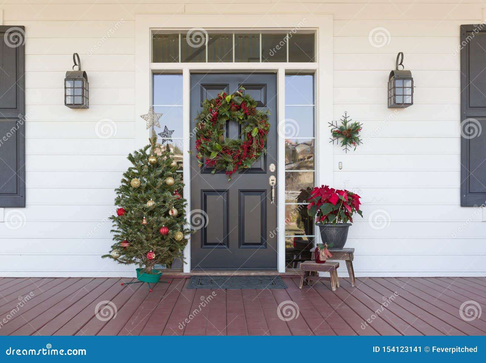 christmas decorations at front door of house