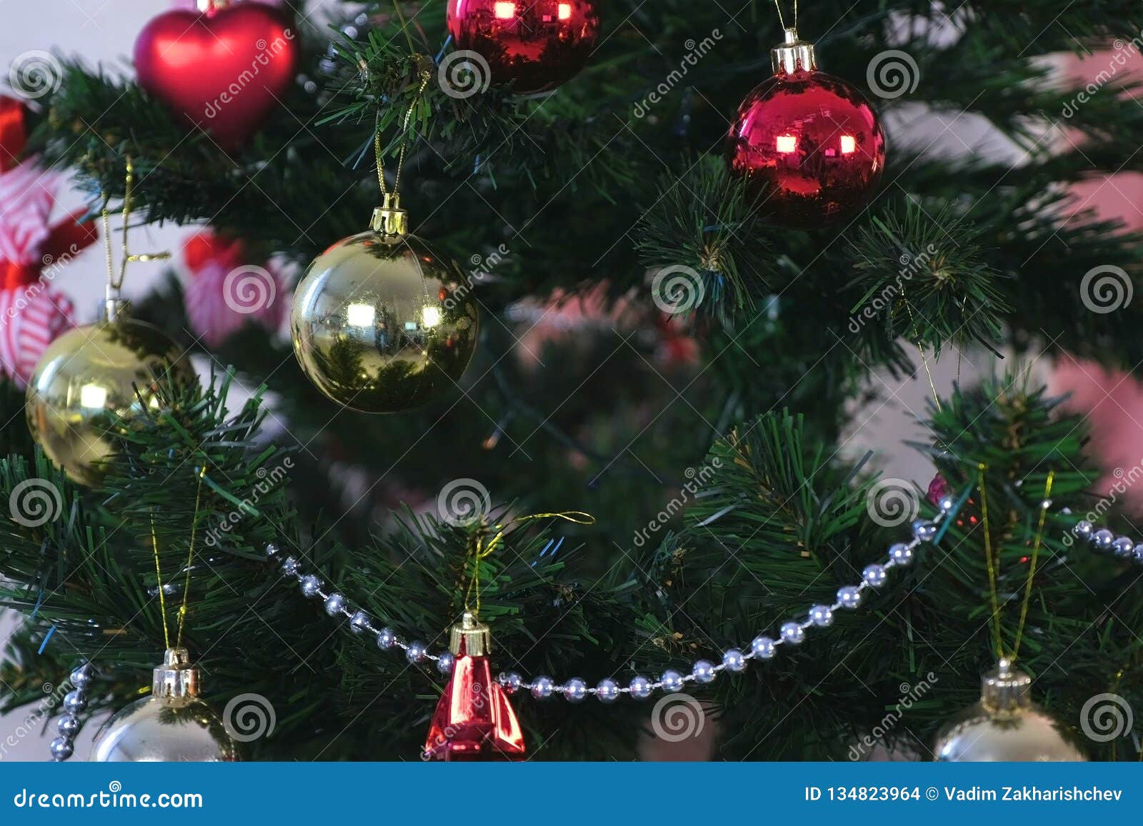 Christmas Decorations In Red And Gold And Silver Beads On