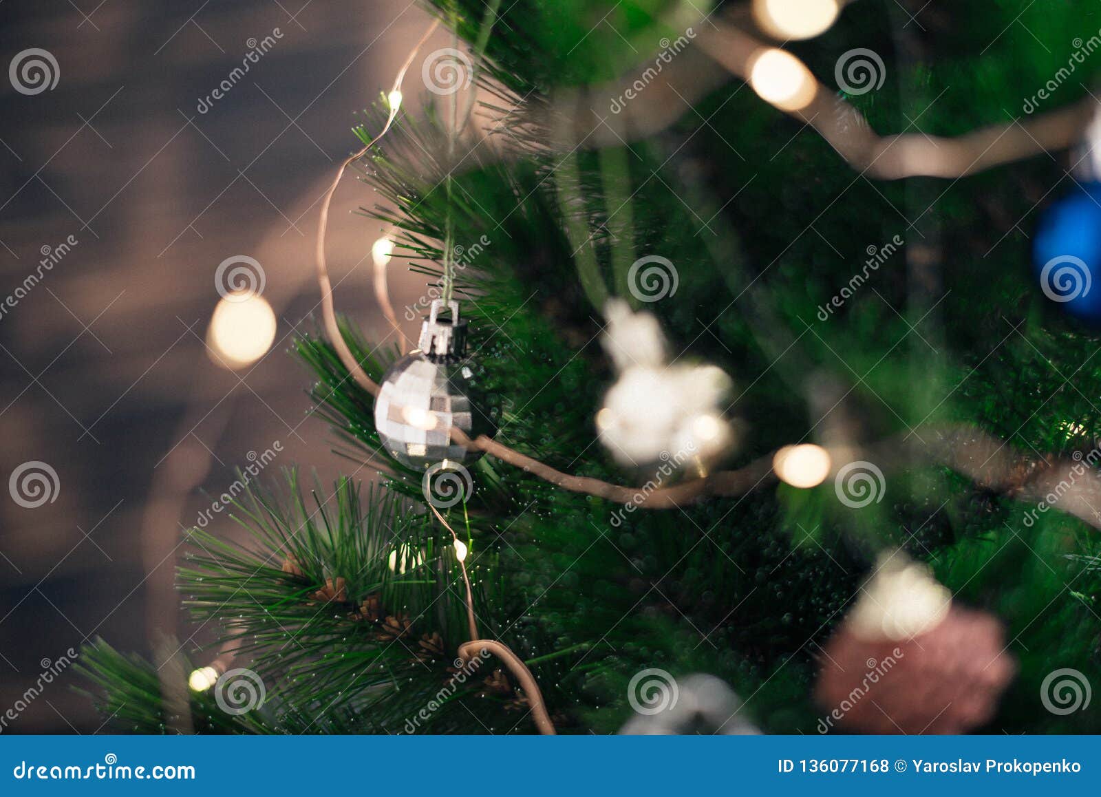 Christmas decorations on the tree with blurred background.