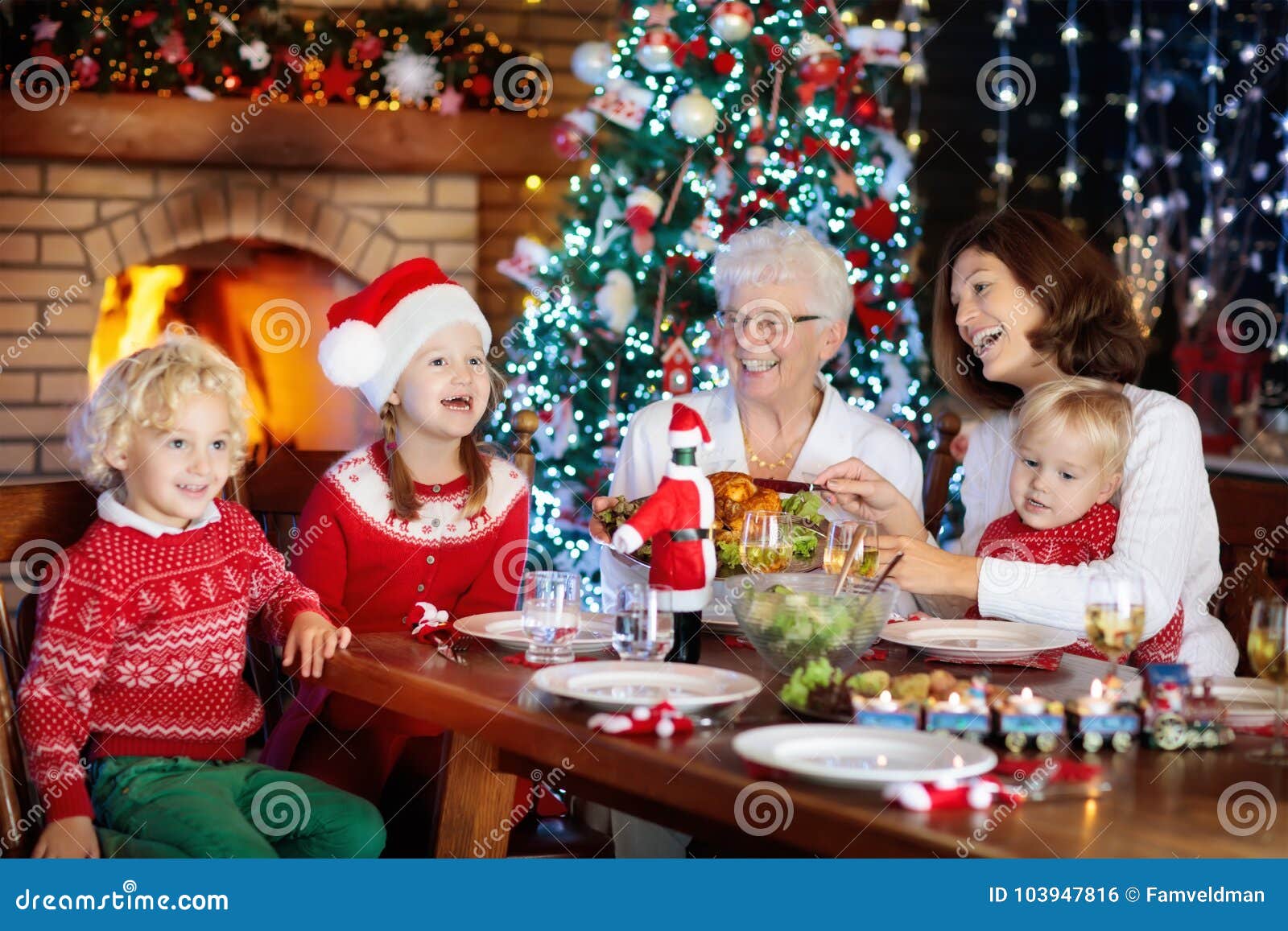 Christmas Dinner. Family with Kids at Xmas Tree. Stock Photo - Image of