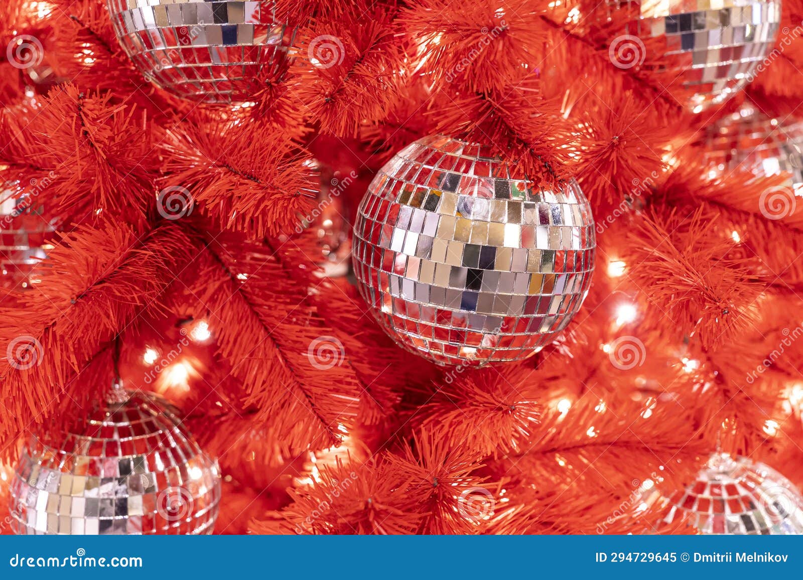 Christmas Disco Ball on Red Christmas Tree. New Year S Background