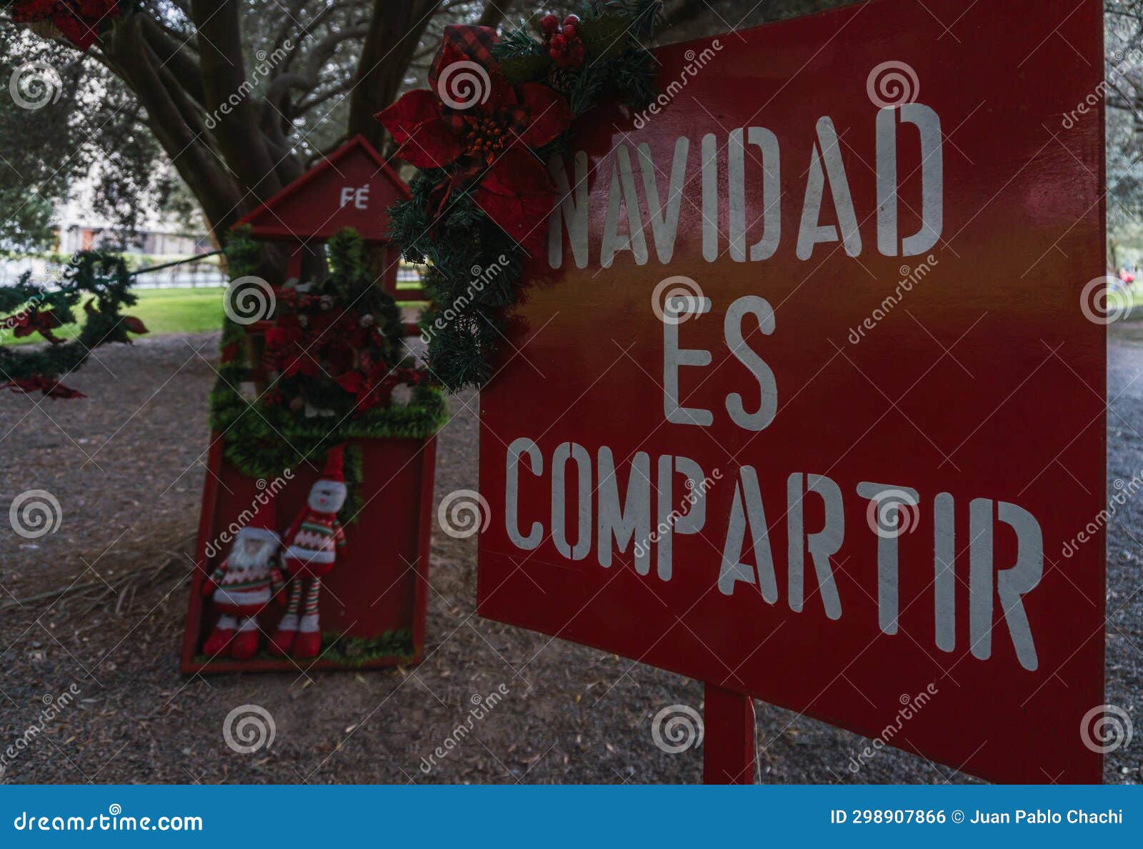 christmas dolls ganging from trees, christmas sign