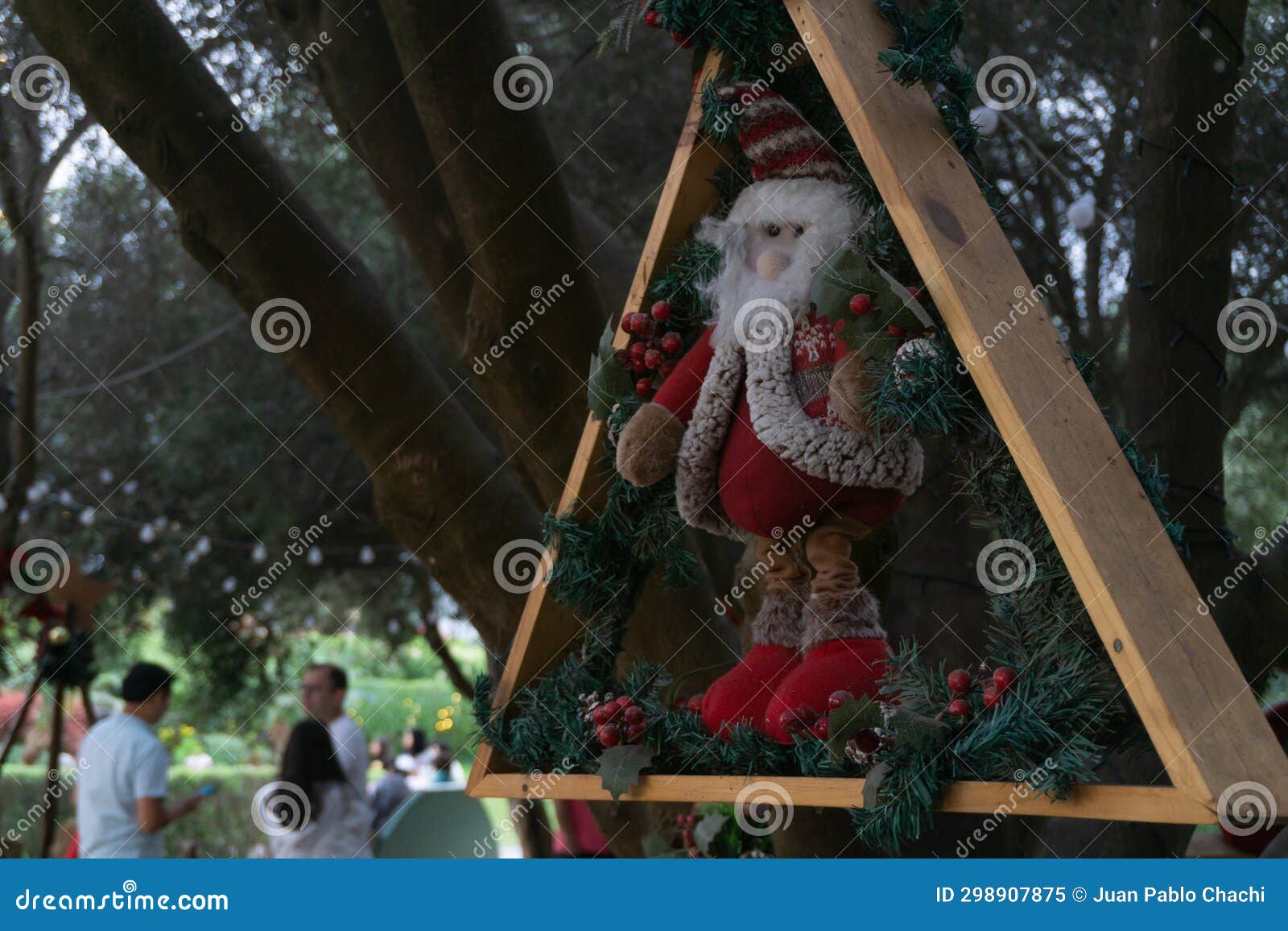 christmas dolls ganging from trees