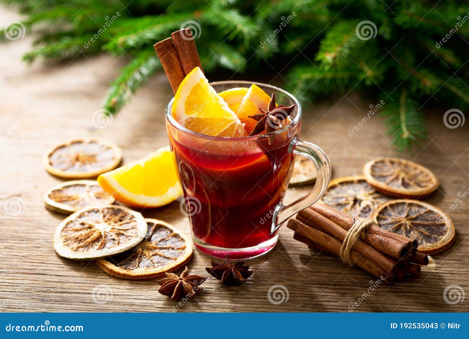 christmas drink. glass of hot mulled wine with oranges, anise and cinnamon