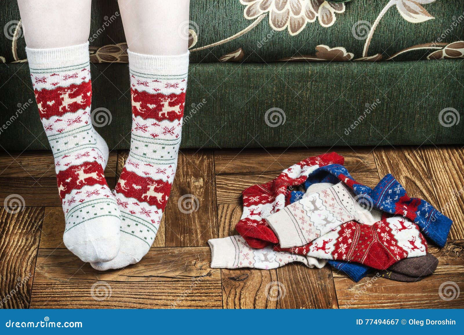 Christmas Female Legs In Socks On The Background Of The Parq