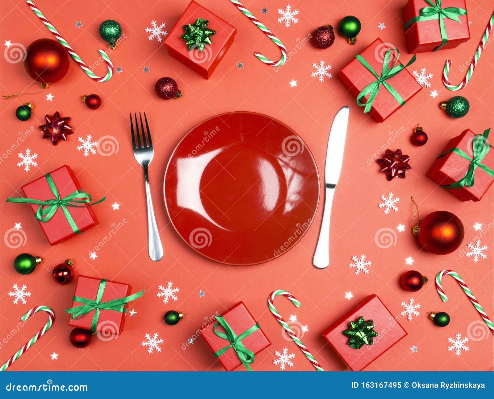 Christmas Festive Table Setting with Cutlery and Decorations on a Red ...