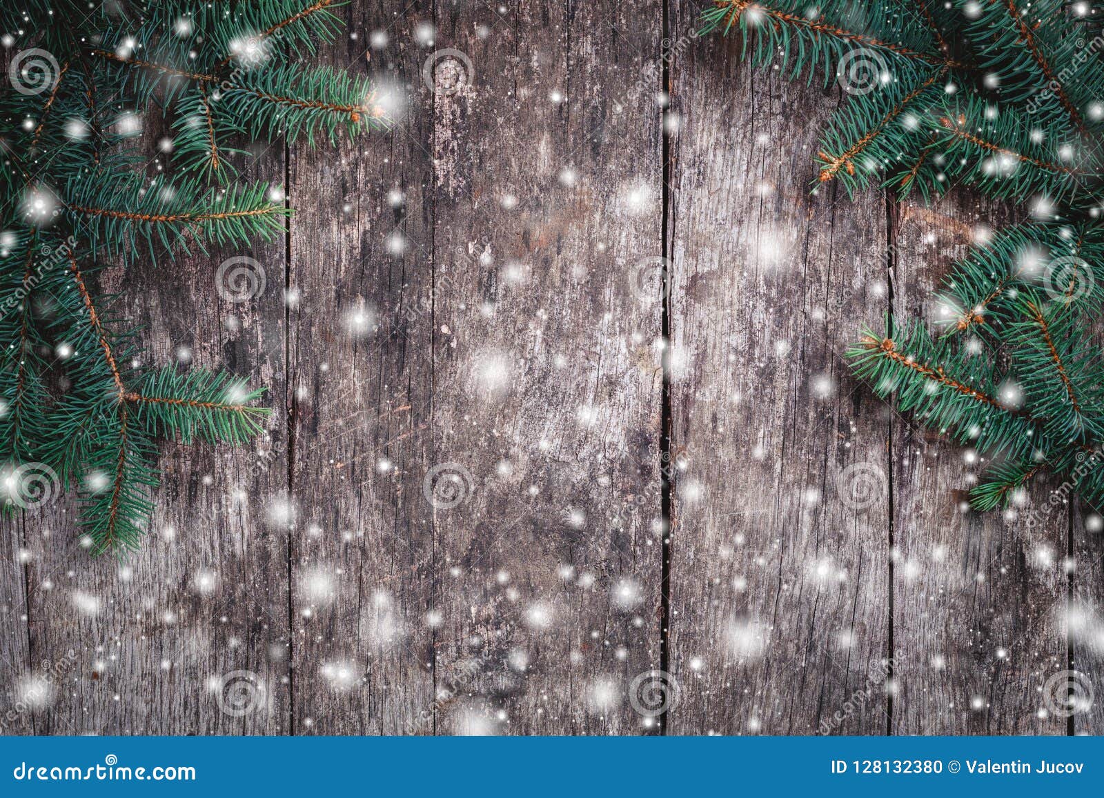 christmas fir branches on wooden background. xmas and happy new year composition.