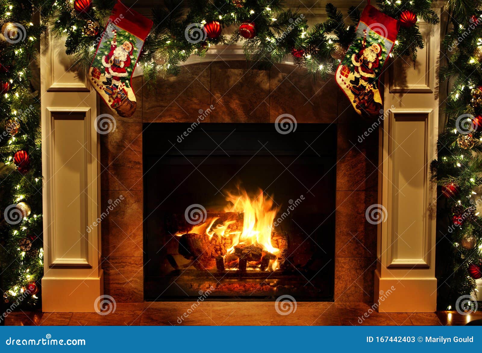christmas fireplace with garlands and stockings