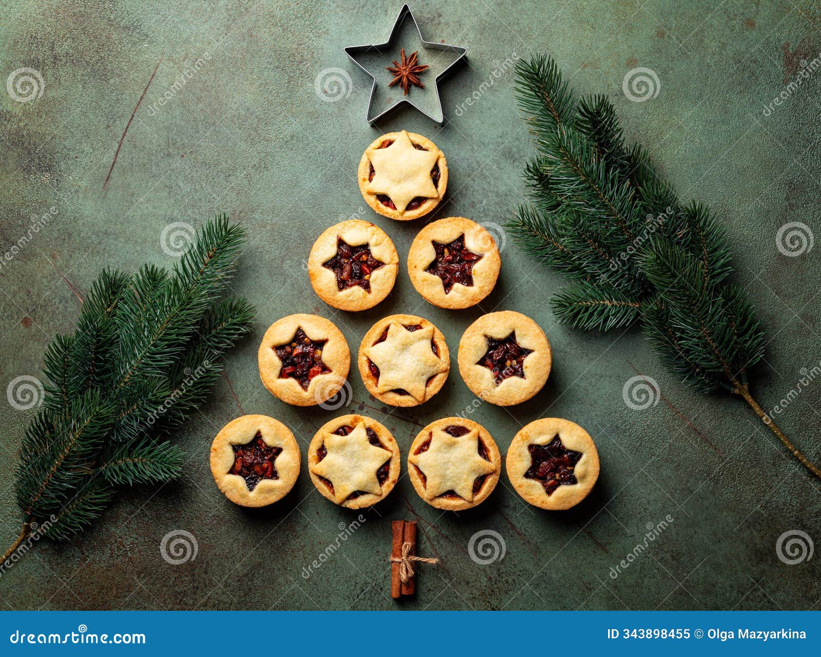 christmas food background with fir tree made from traditional christmas mince pies