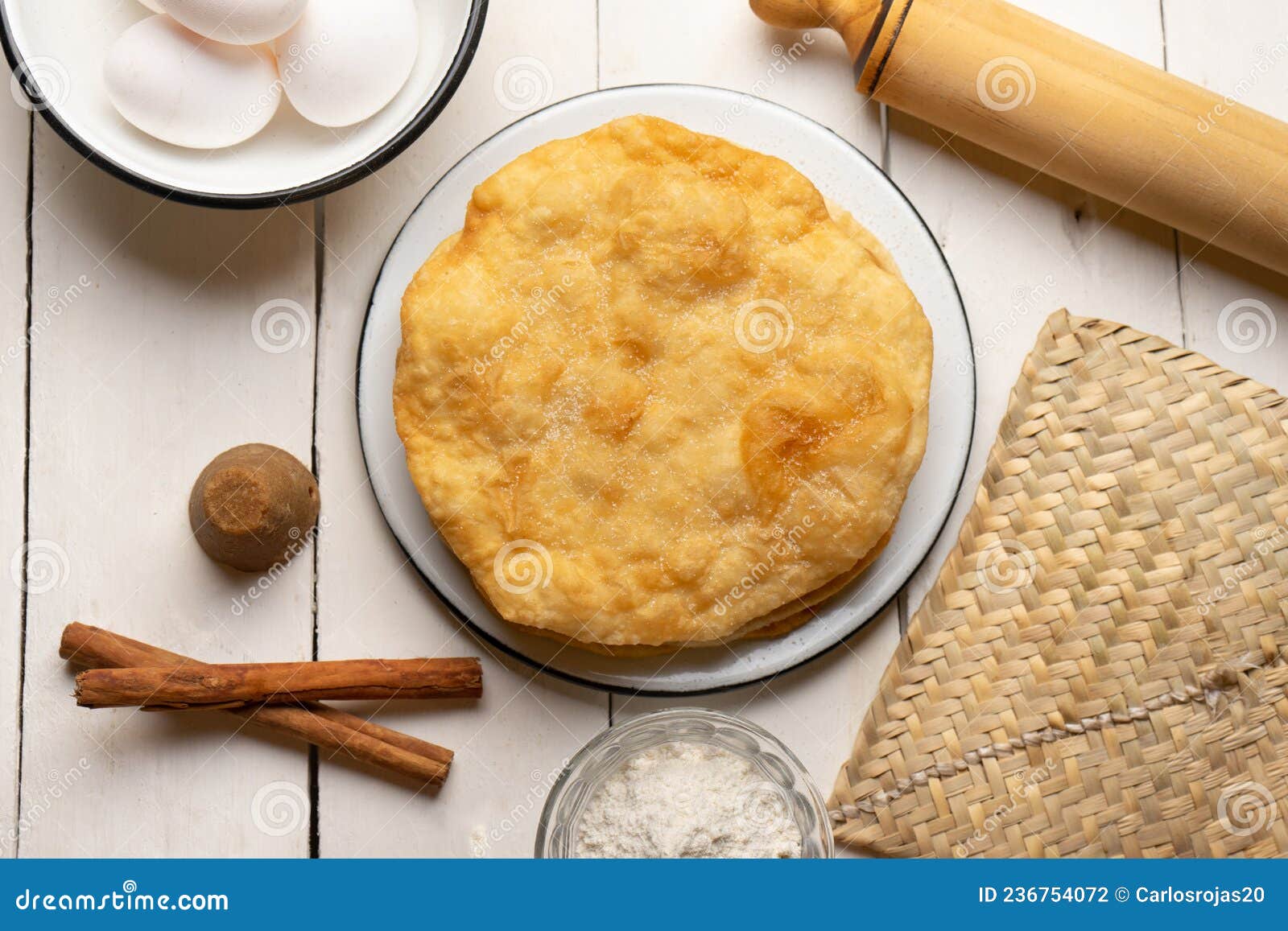 christmas fritters with piloncillo and cinnamon on a white background. mexican food