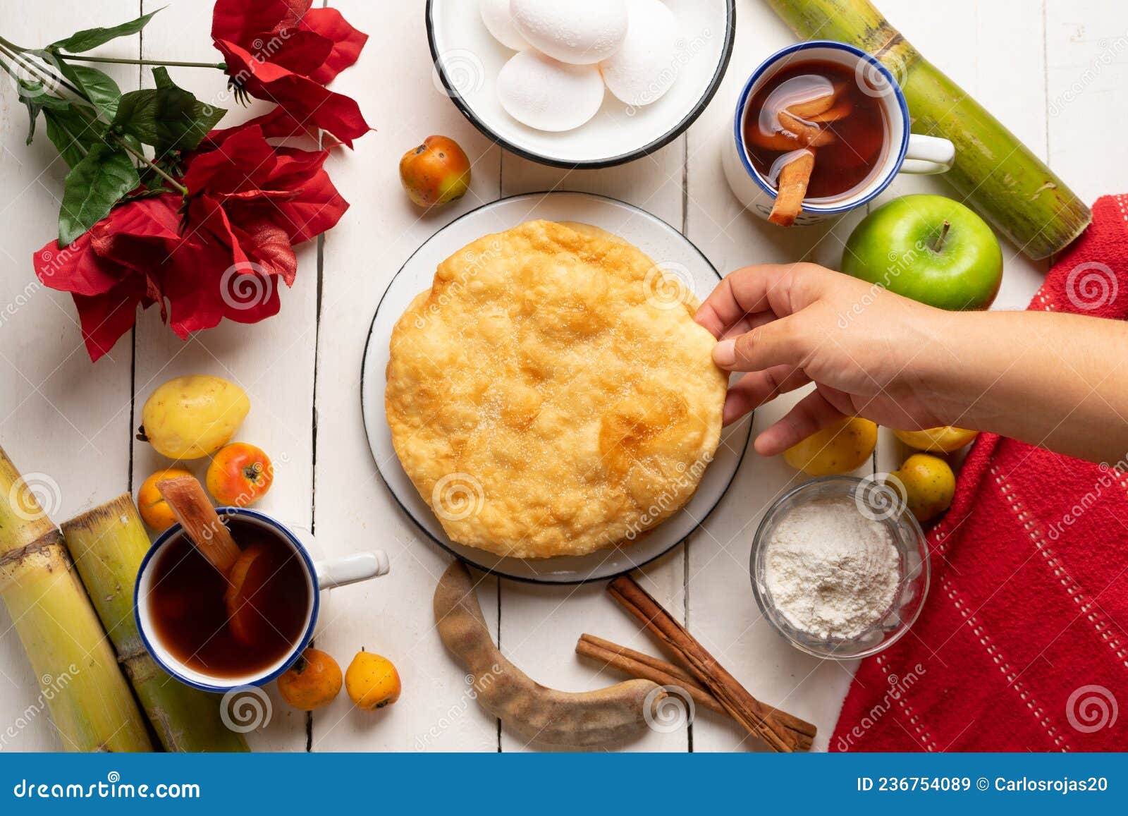 christmas fritters with piloncillo and cinnamon on a white background. mexican food