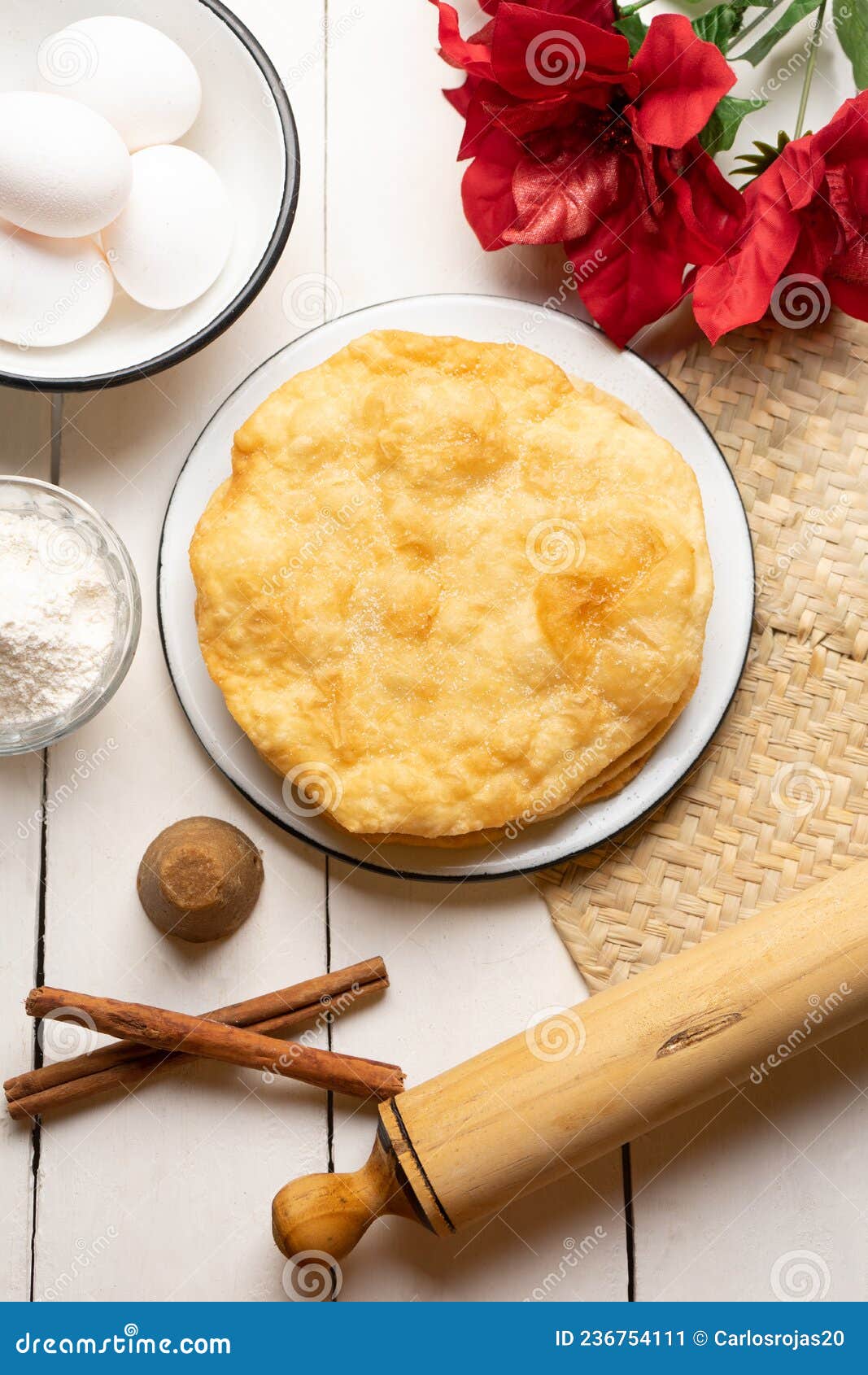 christmas fritters with piloncillo and cinnamon on a white background. mexican food