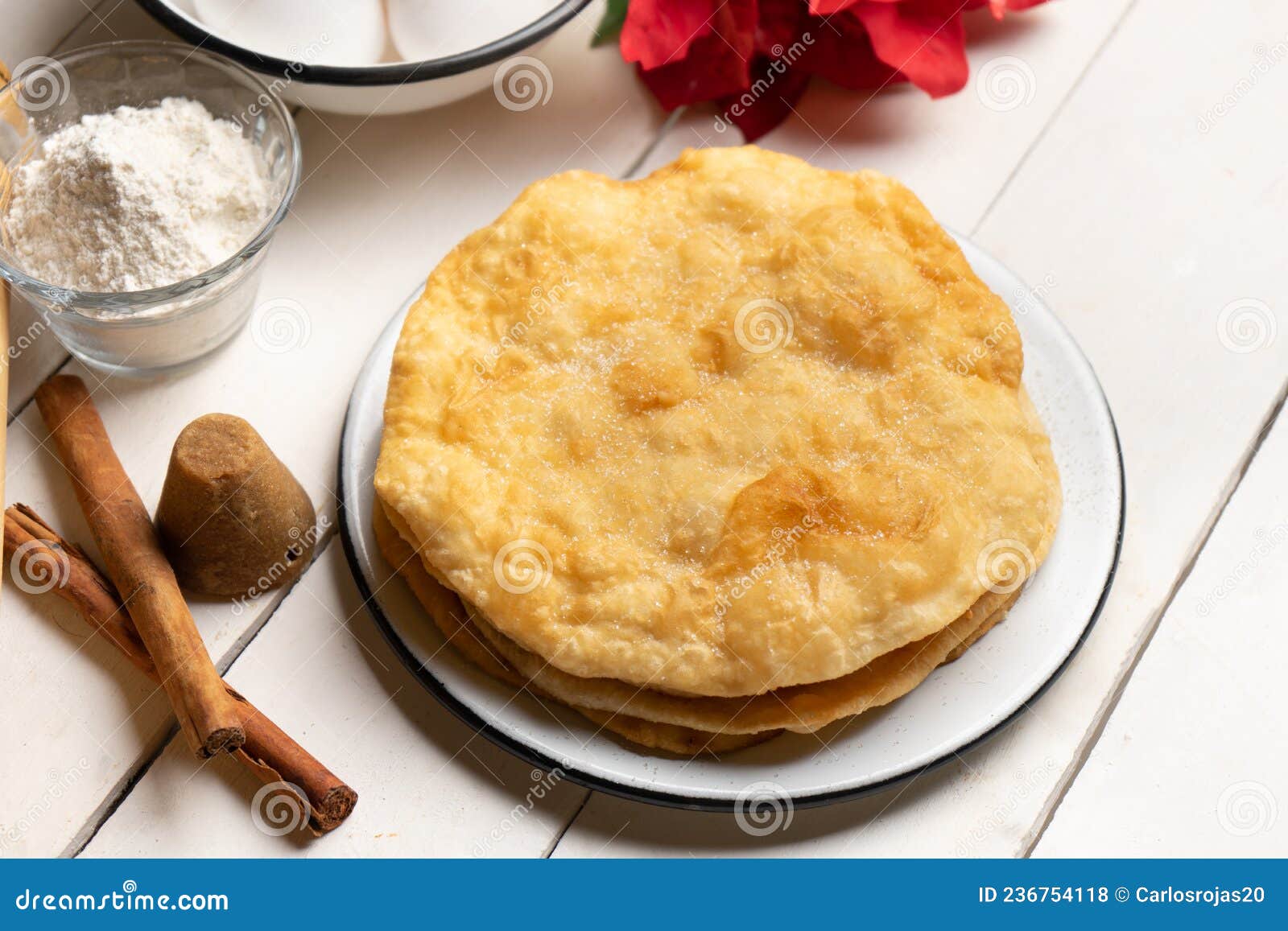christmas fritters with piloncillo and cinnamon on a white background. mexican food