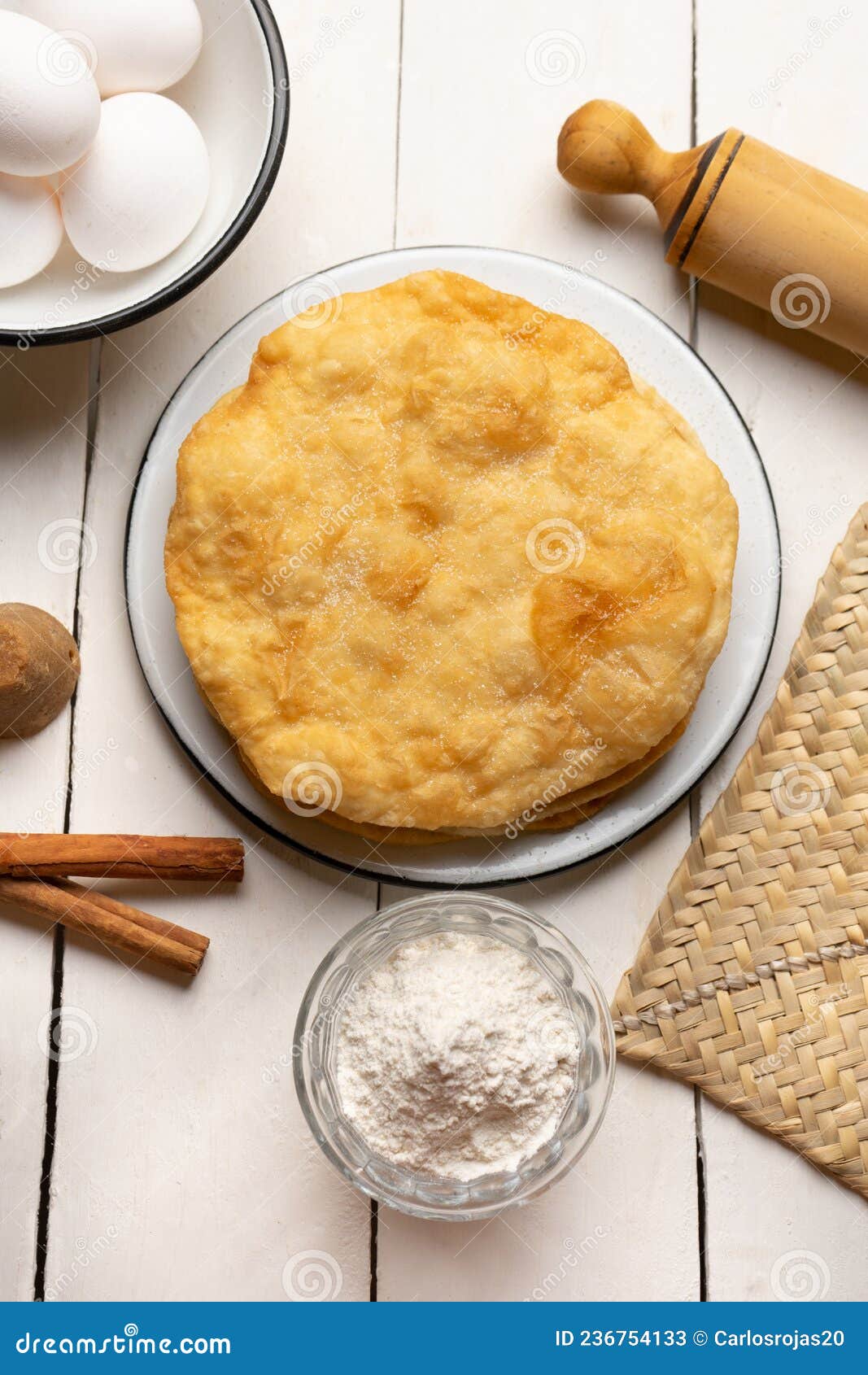 christmas fritters with piloncillo and cinnamon on a white background. mexican food