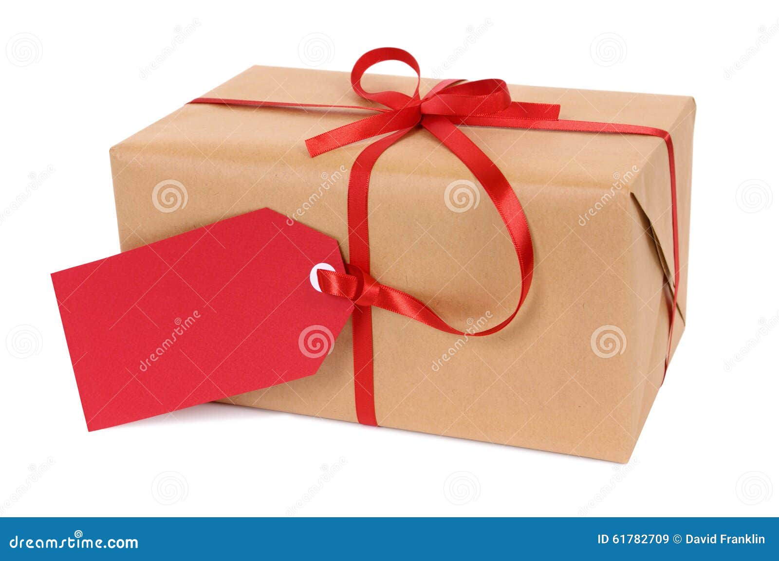 Christmas t or parcel tied with red ribbon and t tag isolated on white background