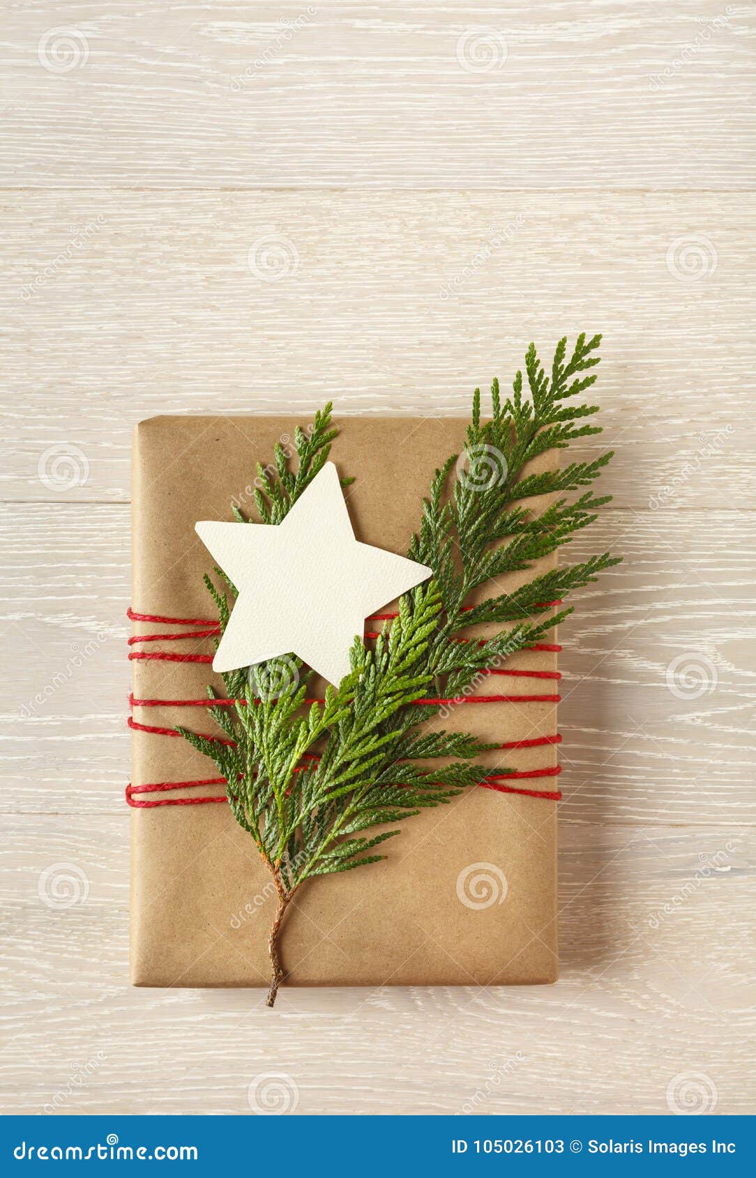 Christmas Gift Present with Recycled Wrapping Paper and Natural Decorations  on Rustic Wood Background Stock Image - Image of life, christmas: 105026103