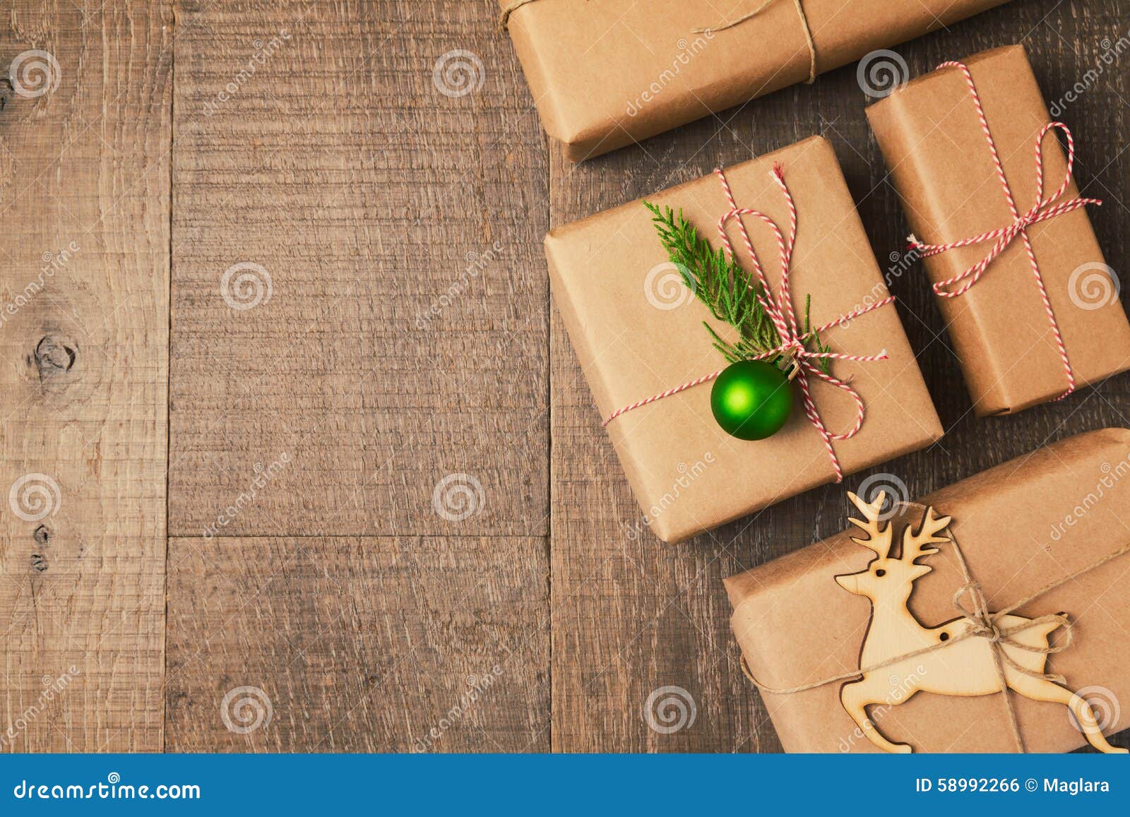 Christmas Background With Gift Boxes And Rolls Of Kraft Wrapping