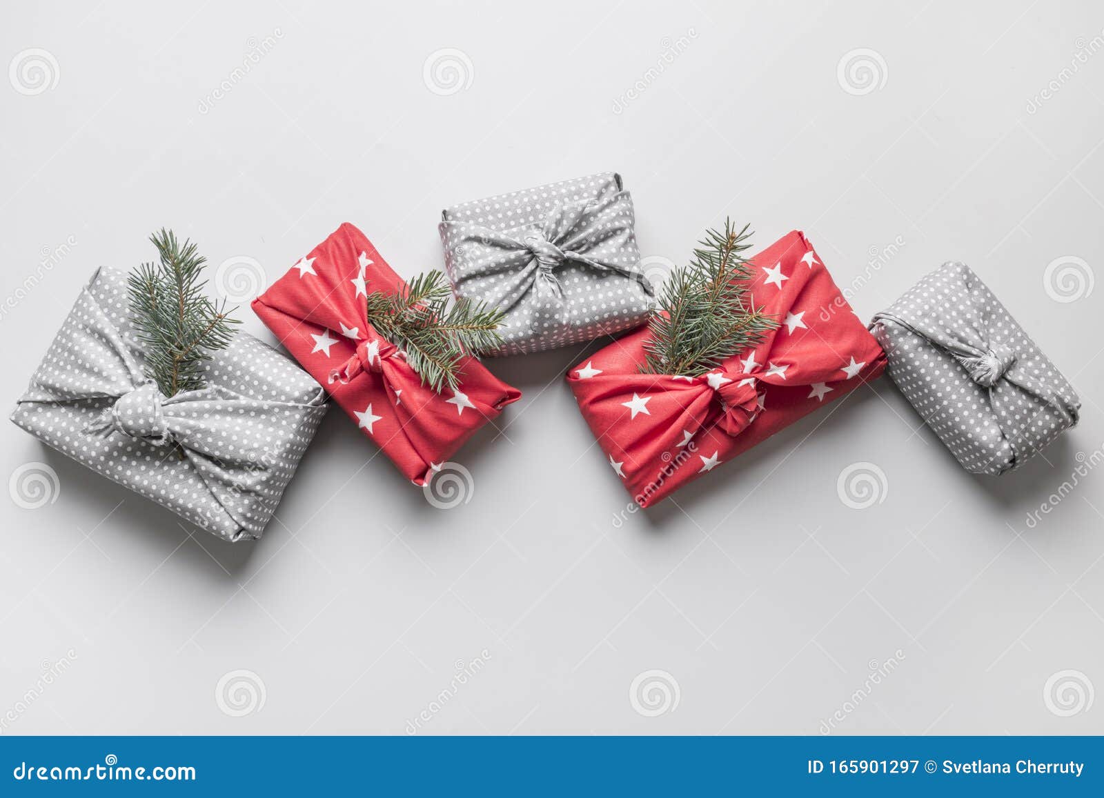 Christmas Gifts Wrapped in Textile with Natural Decor. Sustainable
