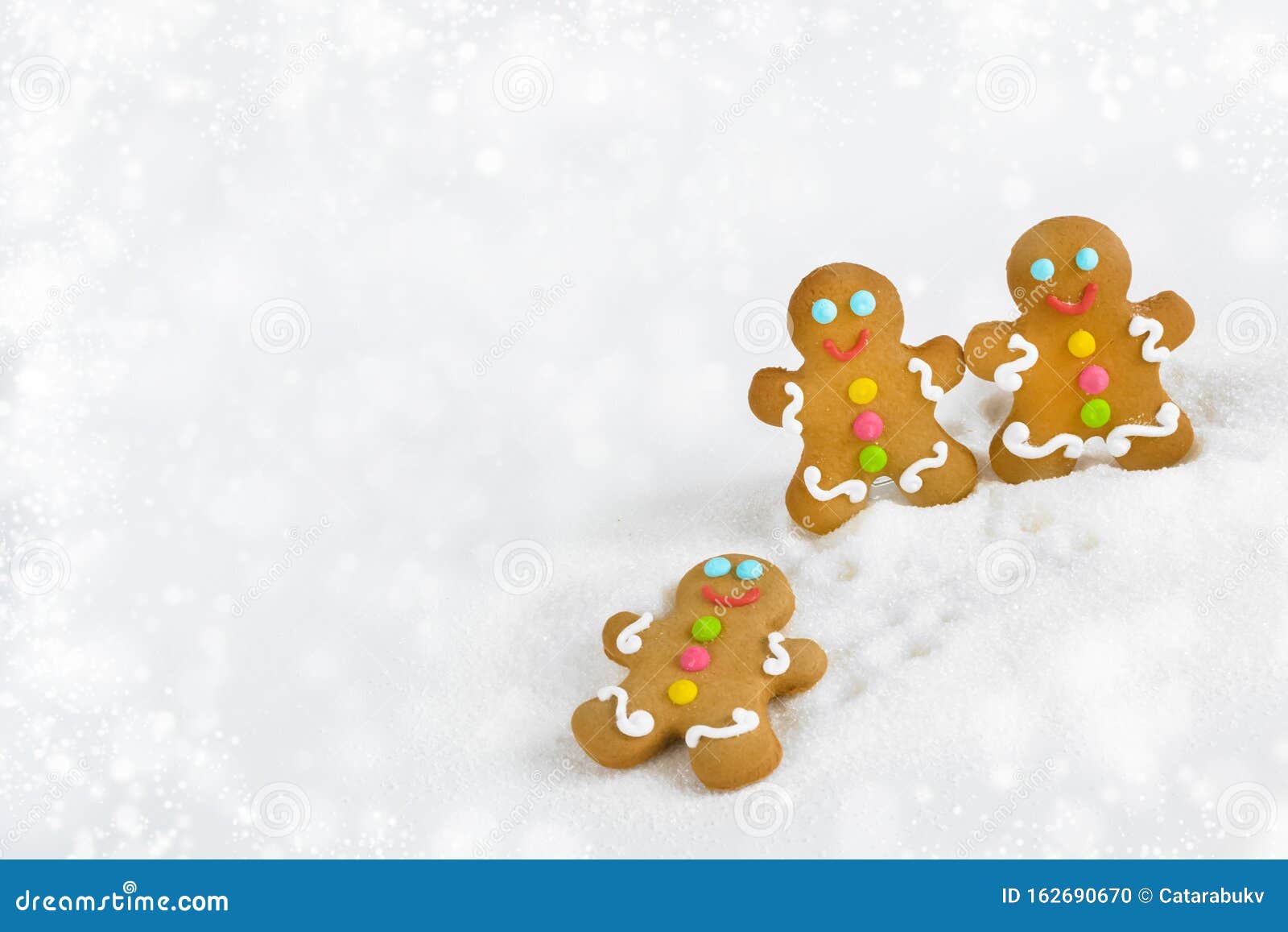 christmas gingerbread men on the background of snow
