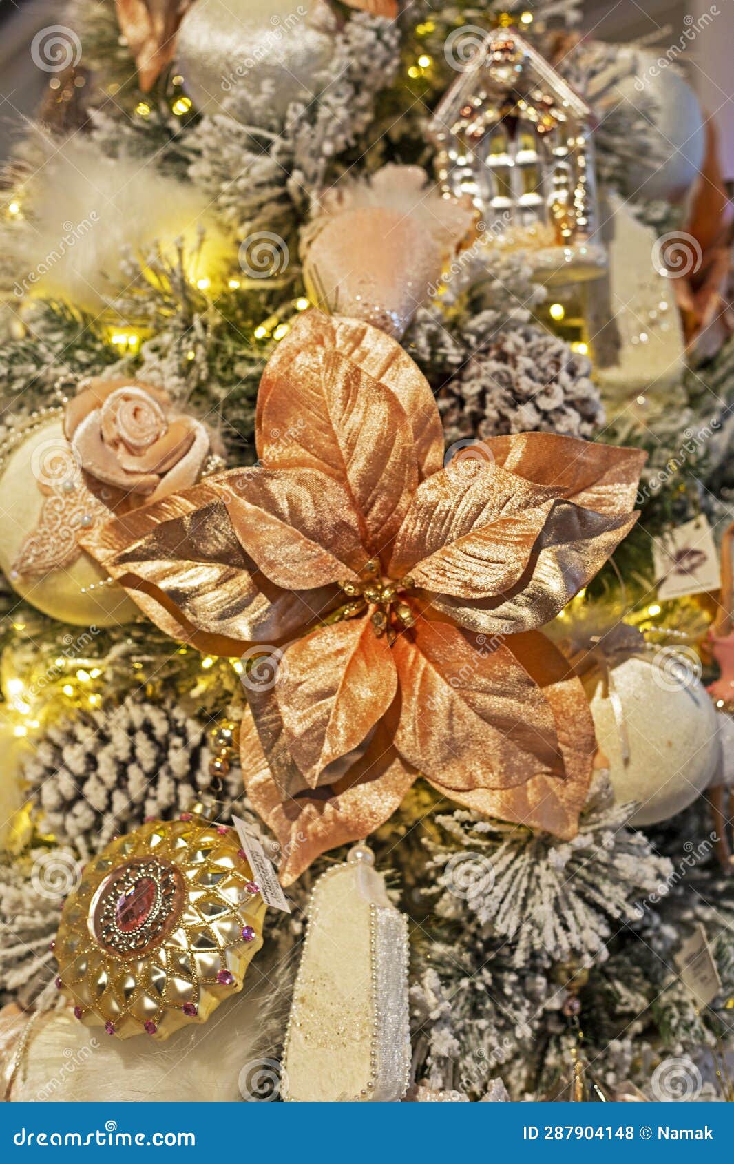 Christmas Golden Flower on Christmas Tree with Other Decorations
