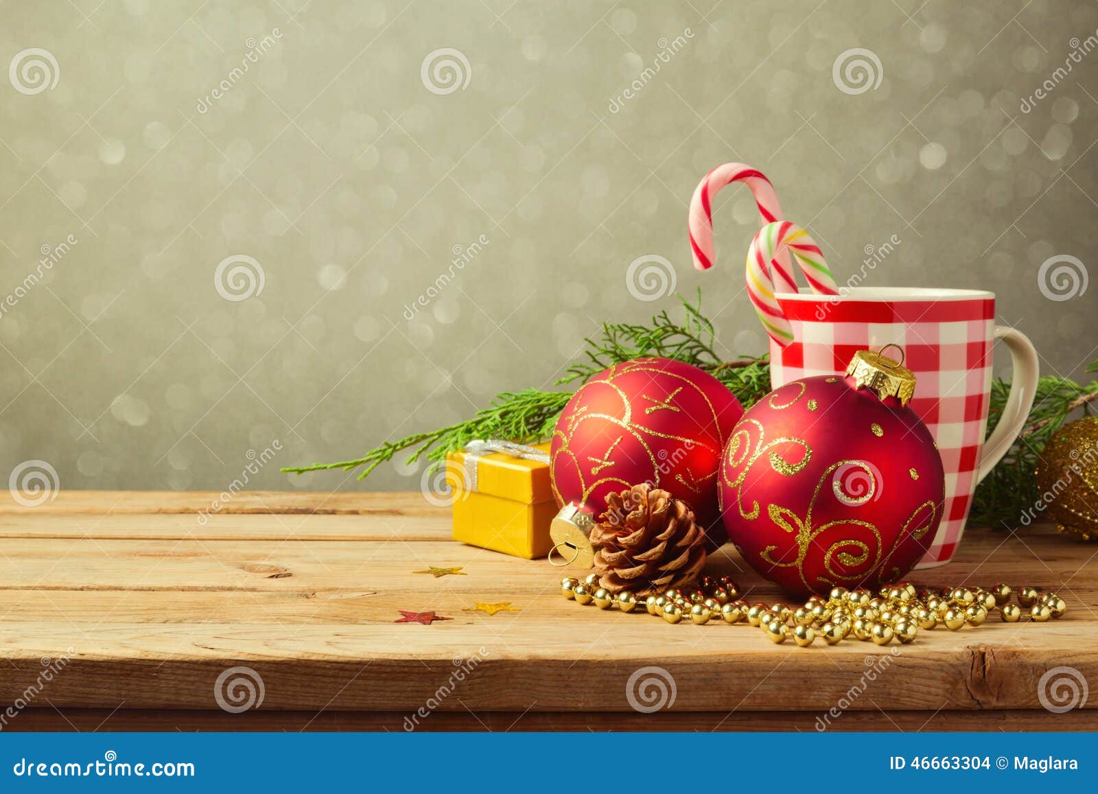 christmas holiday background with checked cup and decorations over blur dreamy background
