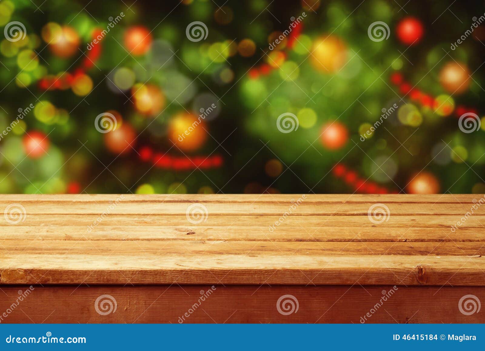 christmas holiday background with empty wooden deck table over festive bokeh. ready for product montage
