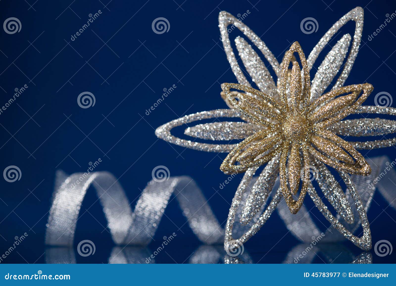 Christmas Holiday Snowflake And Silver Ribbon On Dark Blue 