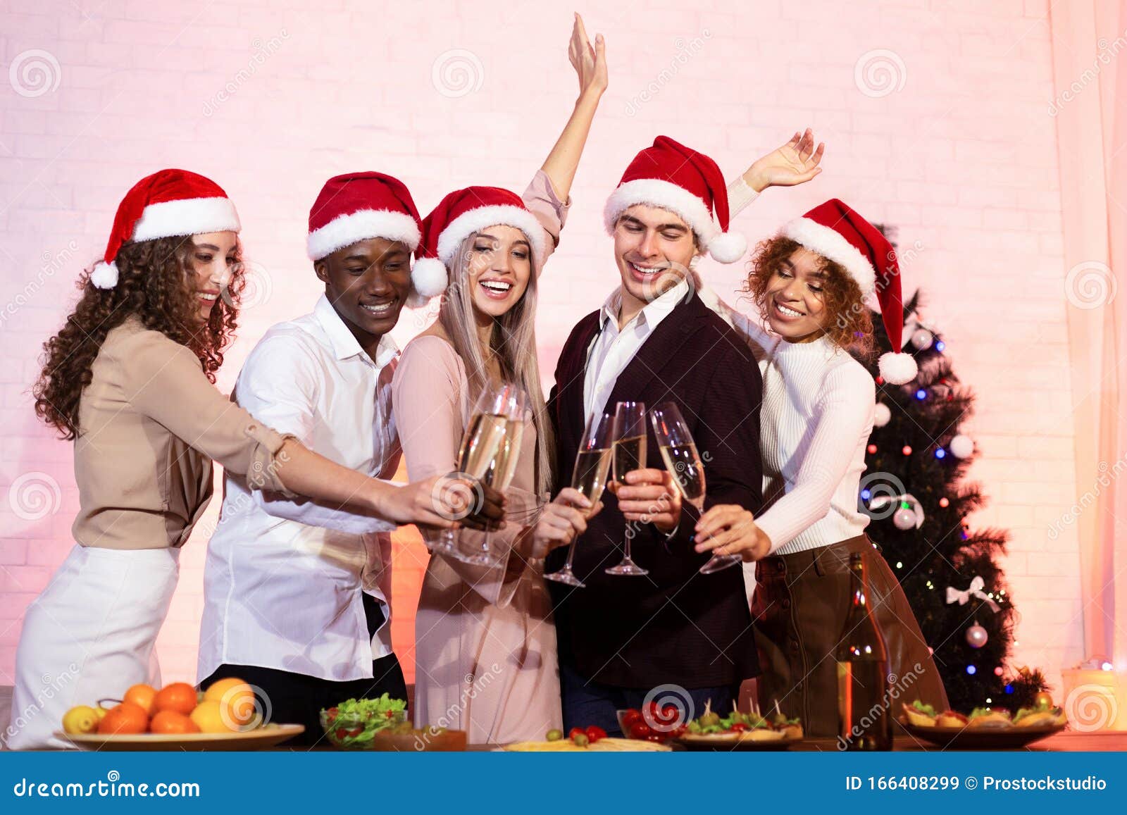 Happy Diverse Friends Celebrating Xmas Clinking Champagne Glasses Standing Indoor Stock Image