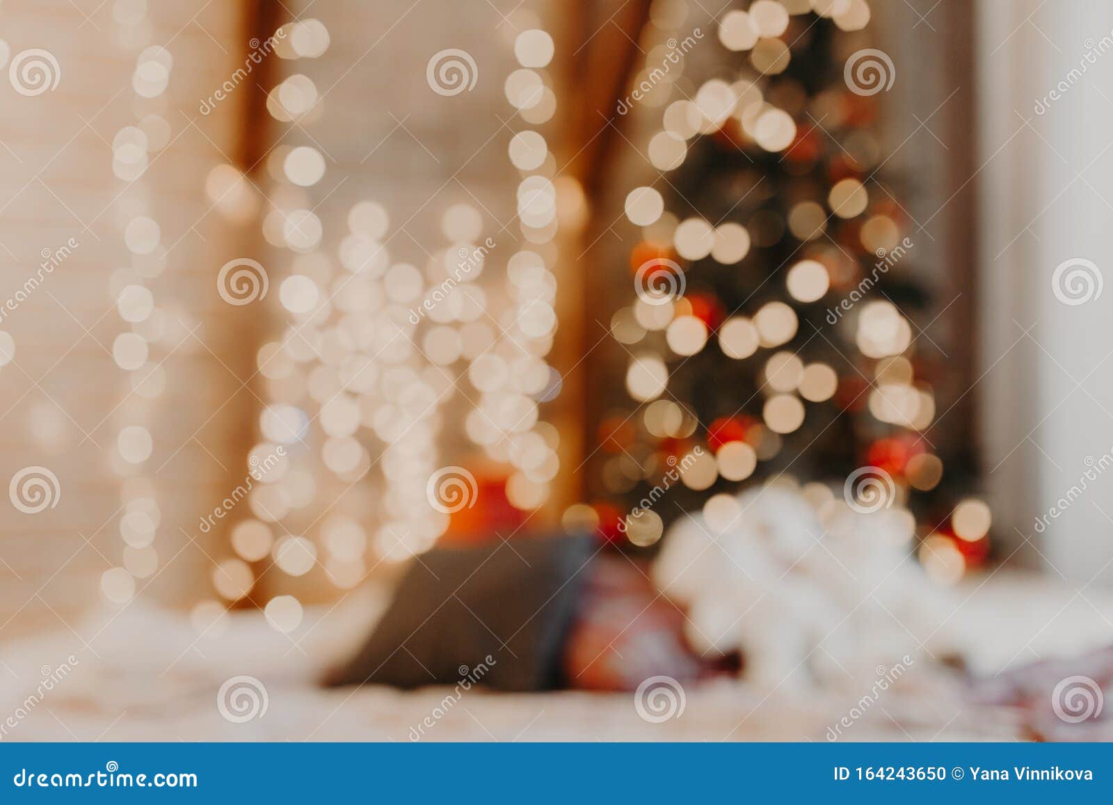 christmas home room with tree and festive bokeh lighting, blurred holiday background