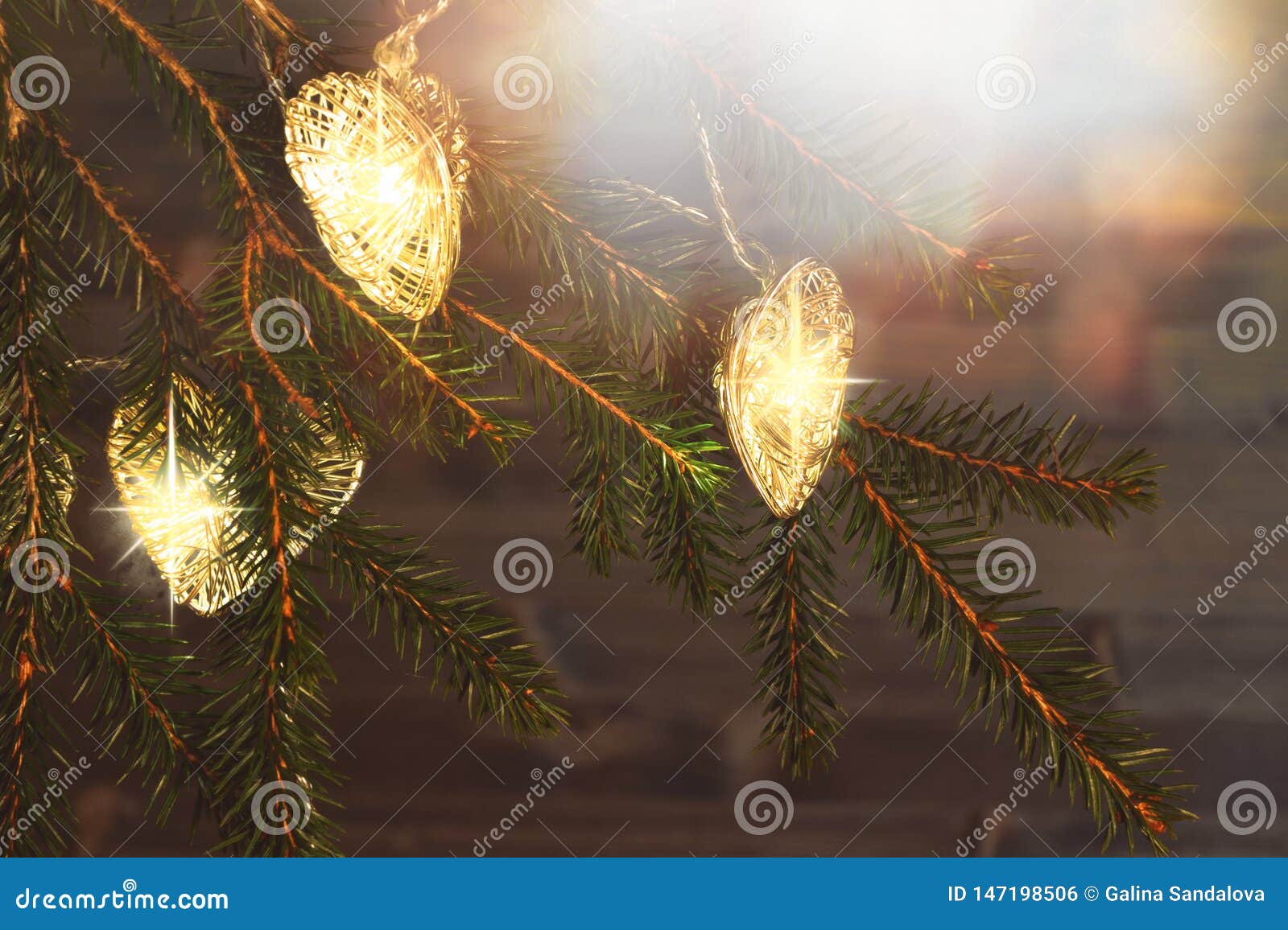 Christmas Lights on Branches of a Christmas Tree on a Dark Wooden ...