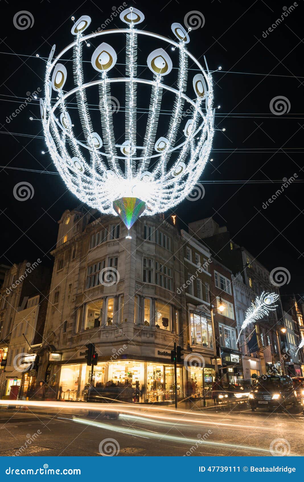 LONDON, UK - 23RD DECEMBER 2015: A View Down New Bond Street In London  During The Christmas Period Showing Building Exteriors, Decorations, People  And Traffic. Stock Photo, Picture and Royalty Free Image. Image 50394734.