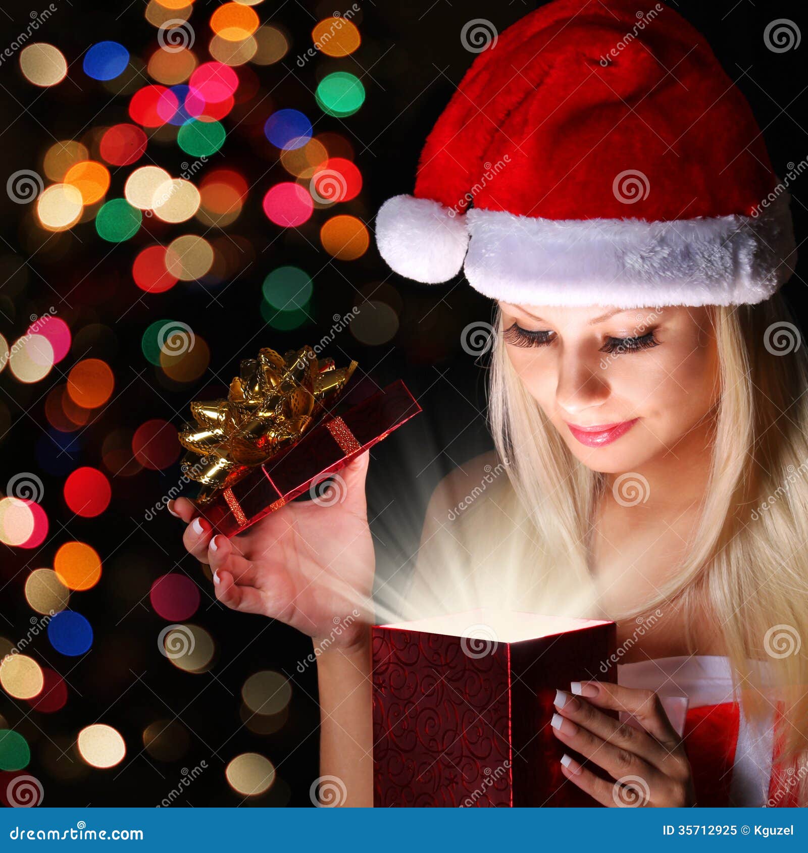 Christmas Miracle. Happy Blonde Girl With Santa Hat 