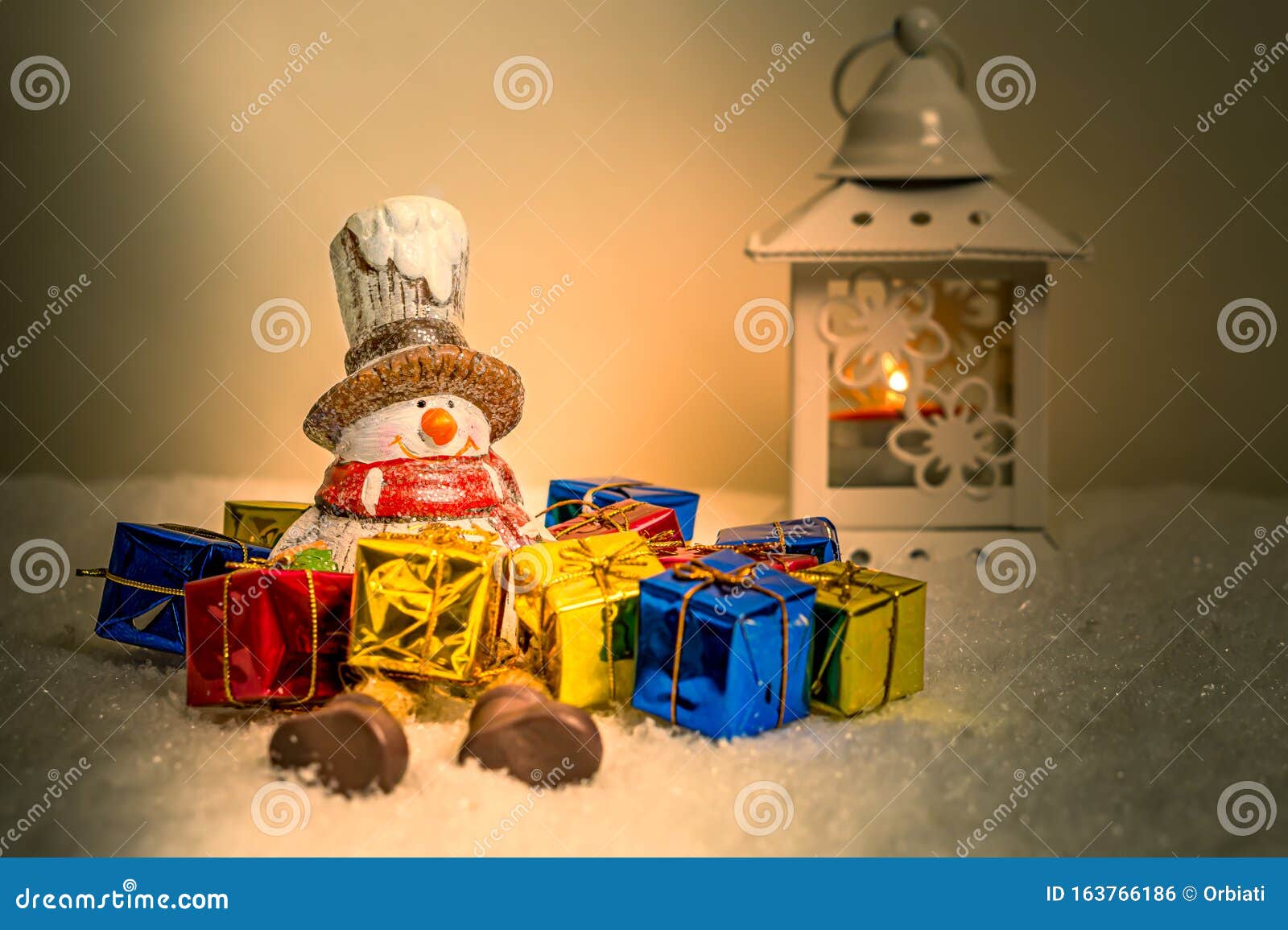 Snowman With Gift Boxes Simulated Snowfall In The Background With A Candle Holder Stock Photo Image Of Throw Simulated