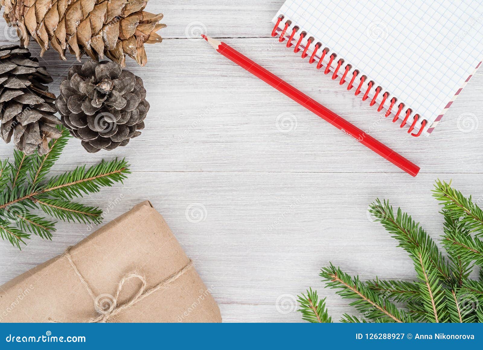 christmas 2019. new year`s composition - cones, branches, notepa