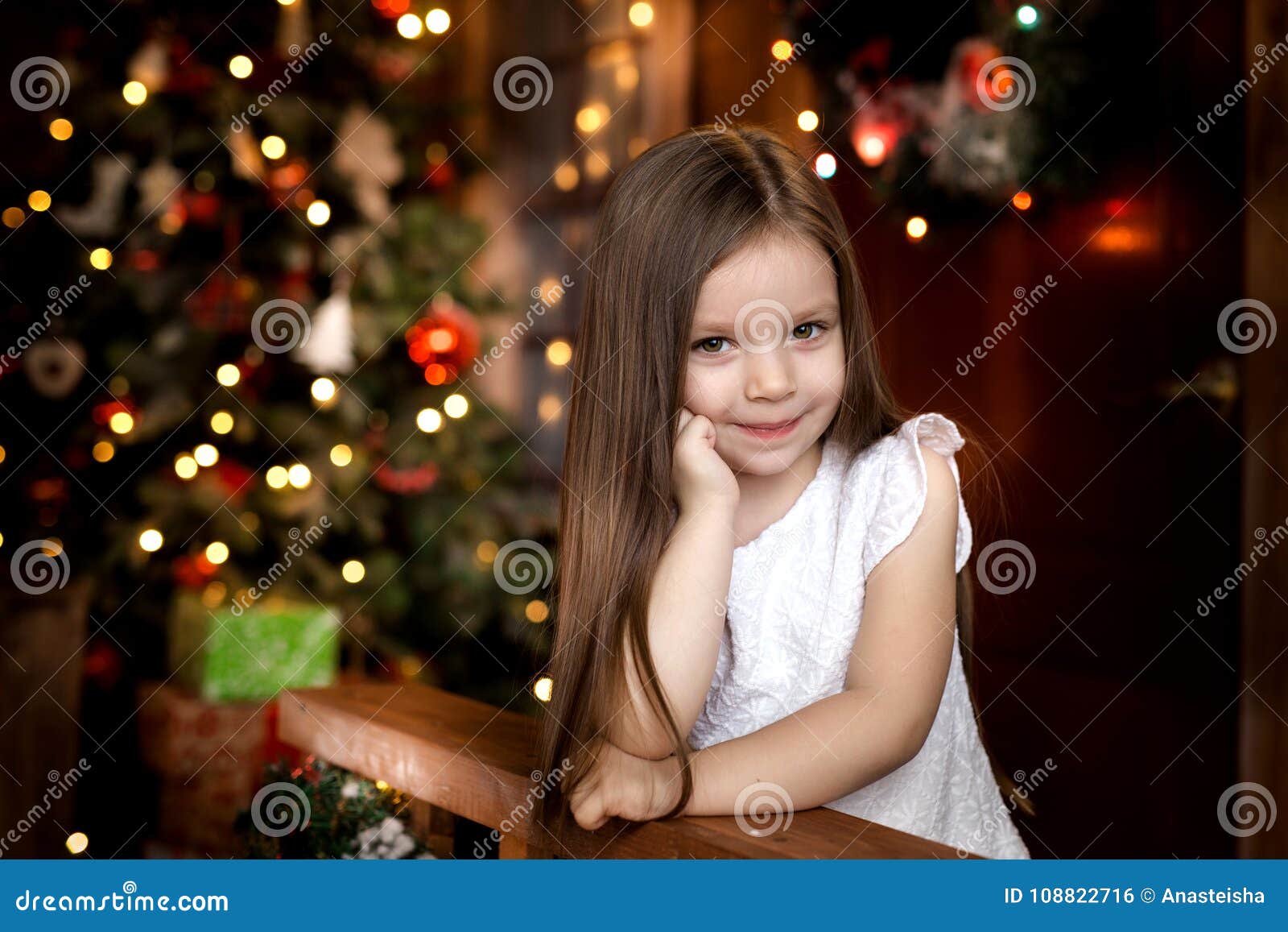 On Christmas Night a Little Girl Waiting for Santa Claus. Stock Photo ...