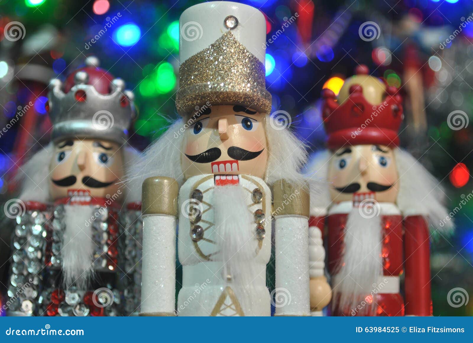 Christmas Nutcrackers In The Hands Of Girls On The Background Of The