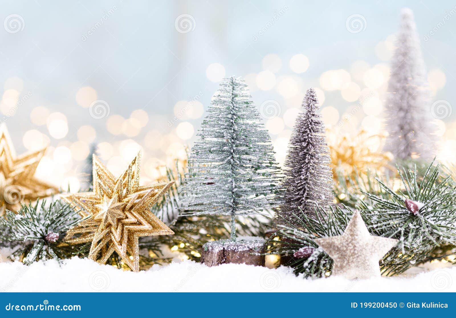 Christmas Ornament with String Lights on Blue Background Stock Photo
