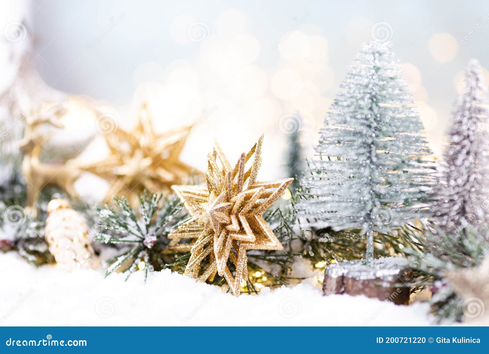 Christmas Ornament with String Lights on Blue Background Stock Photo