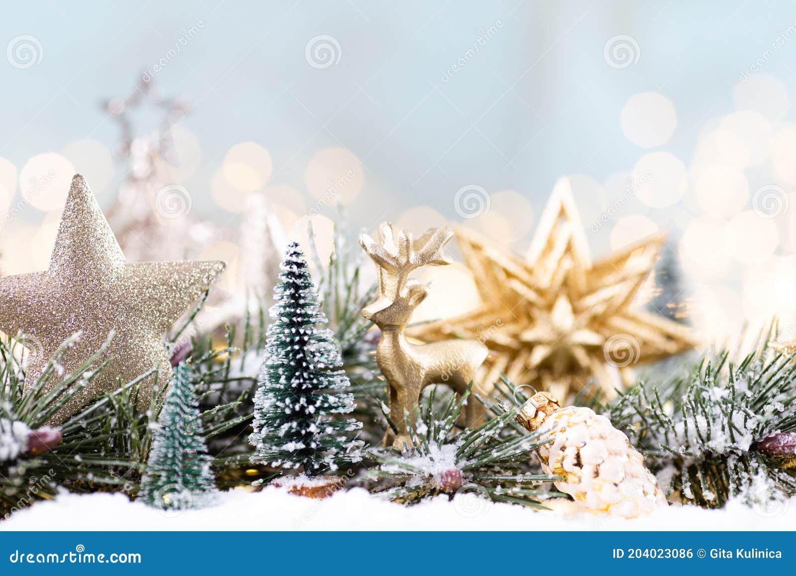 Christmas Ornament with String Lights on Blue Background Stock Photo