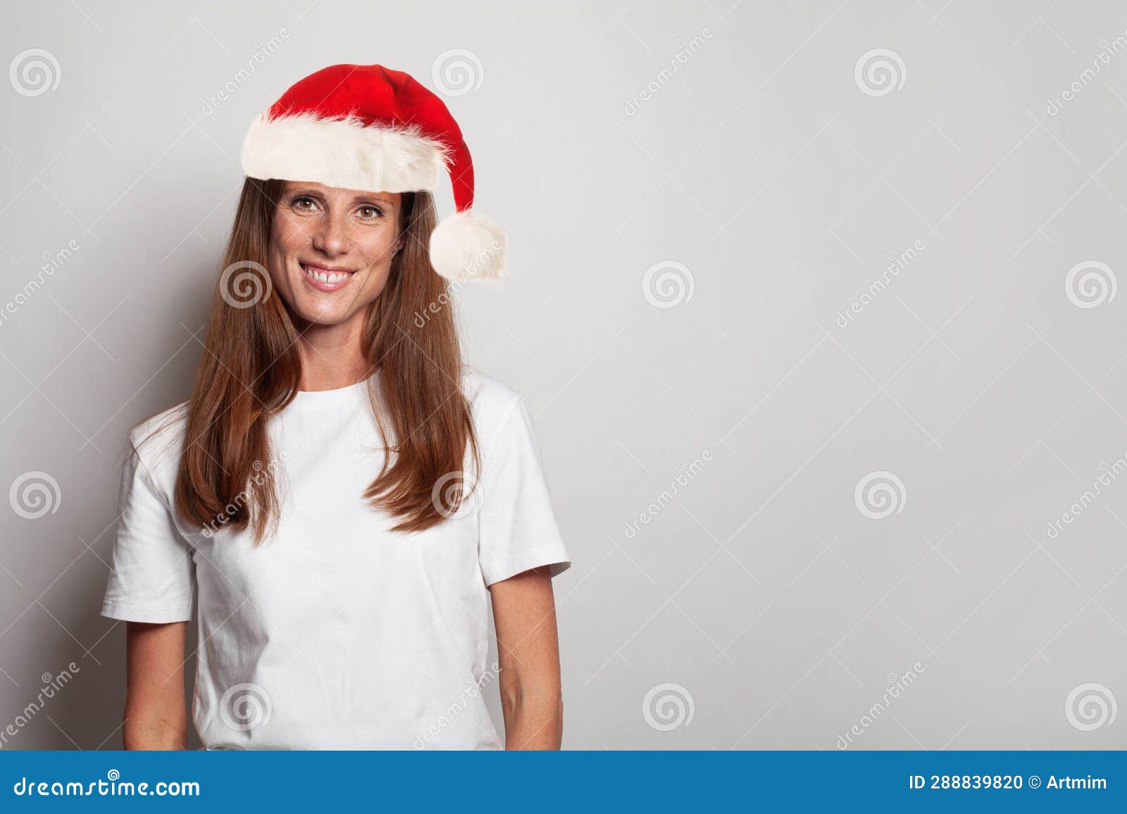 christmas portrait of happy woman sante in white t-shirt on white background