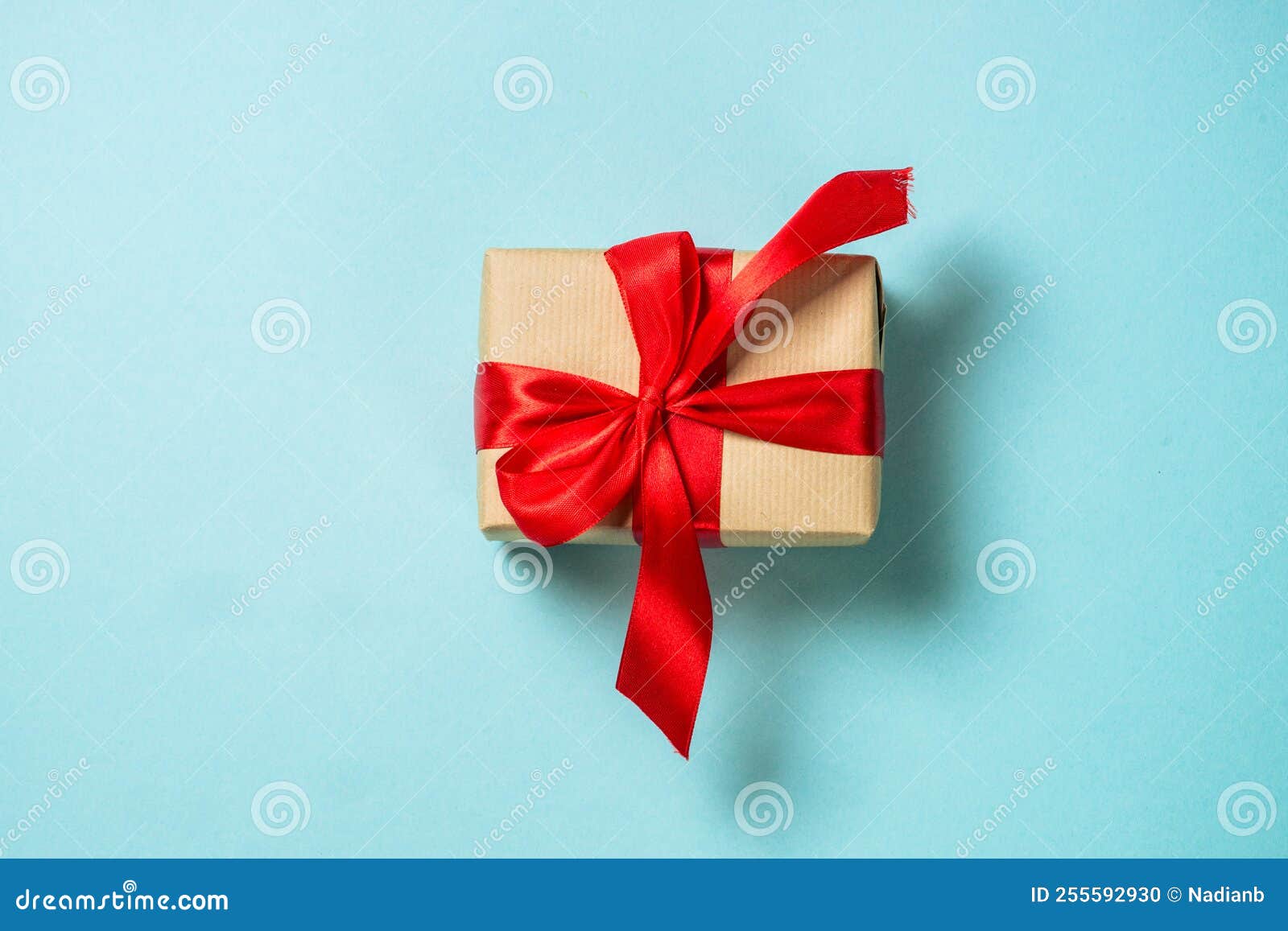Christmas Present Box with Red Ribbon at Blue. Stock Photo Image of