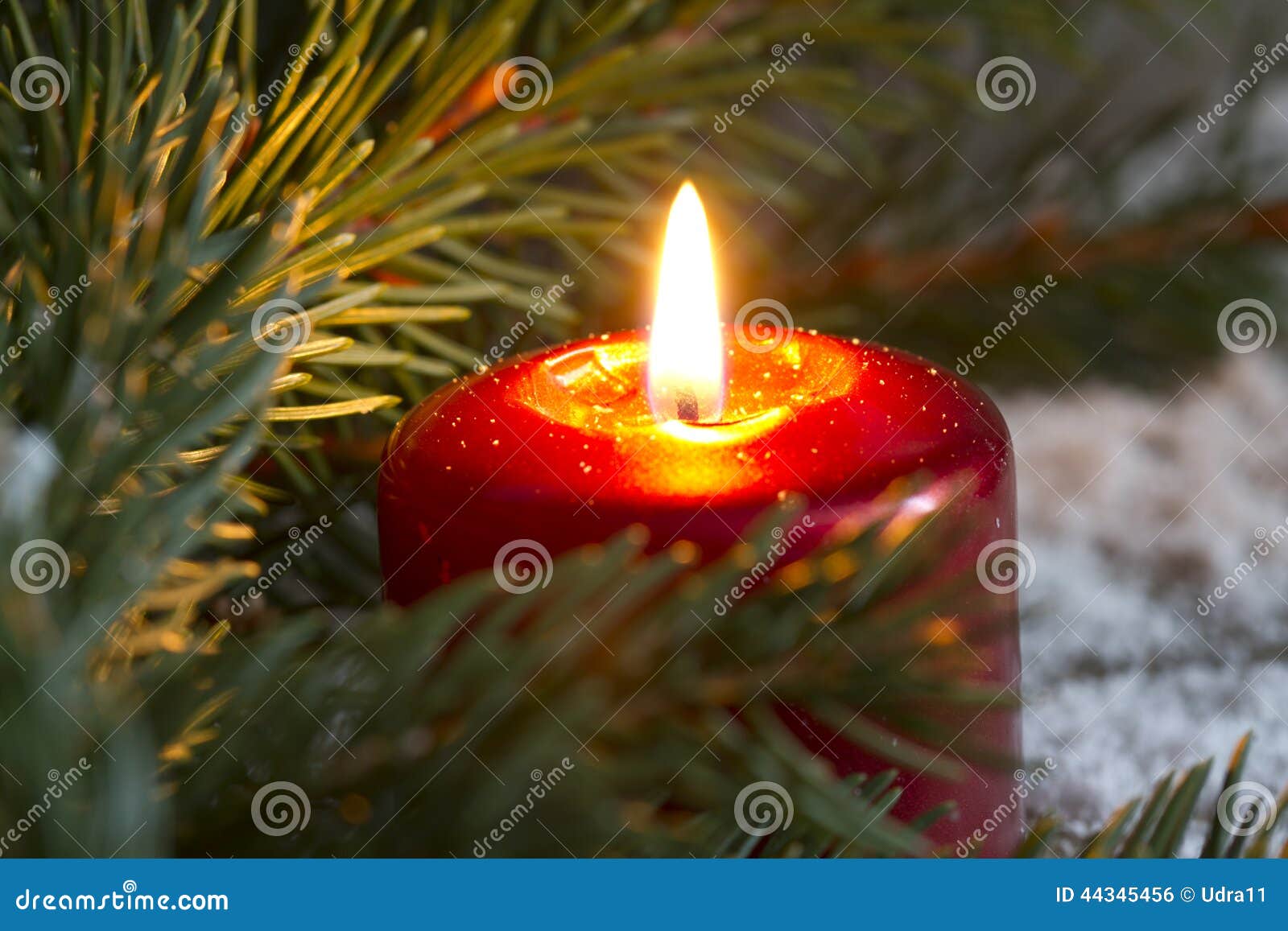 christmas red candle wit fir closeup