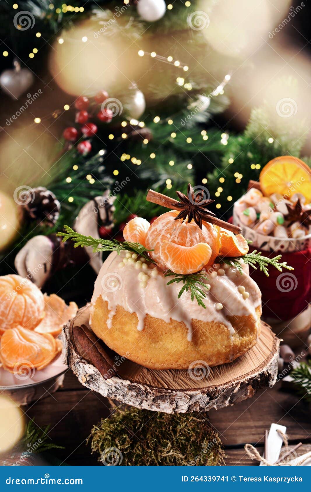 Christmas Ring Cake with Fresh Mandarin Decoration on Festive Table in