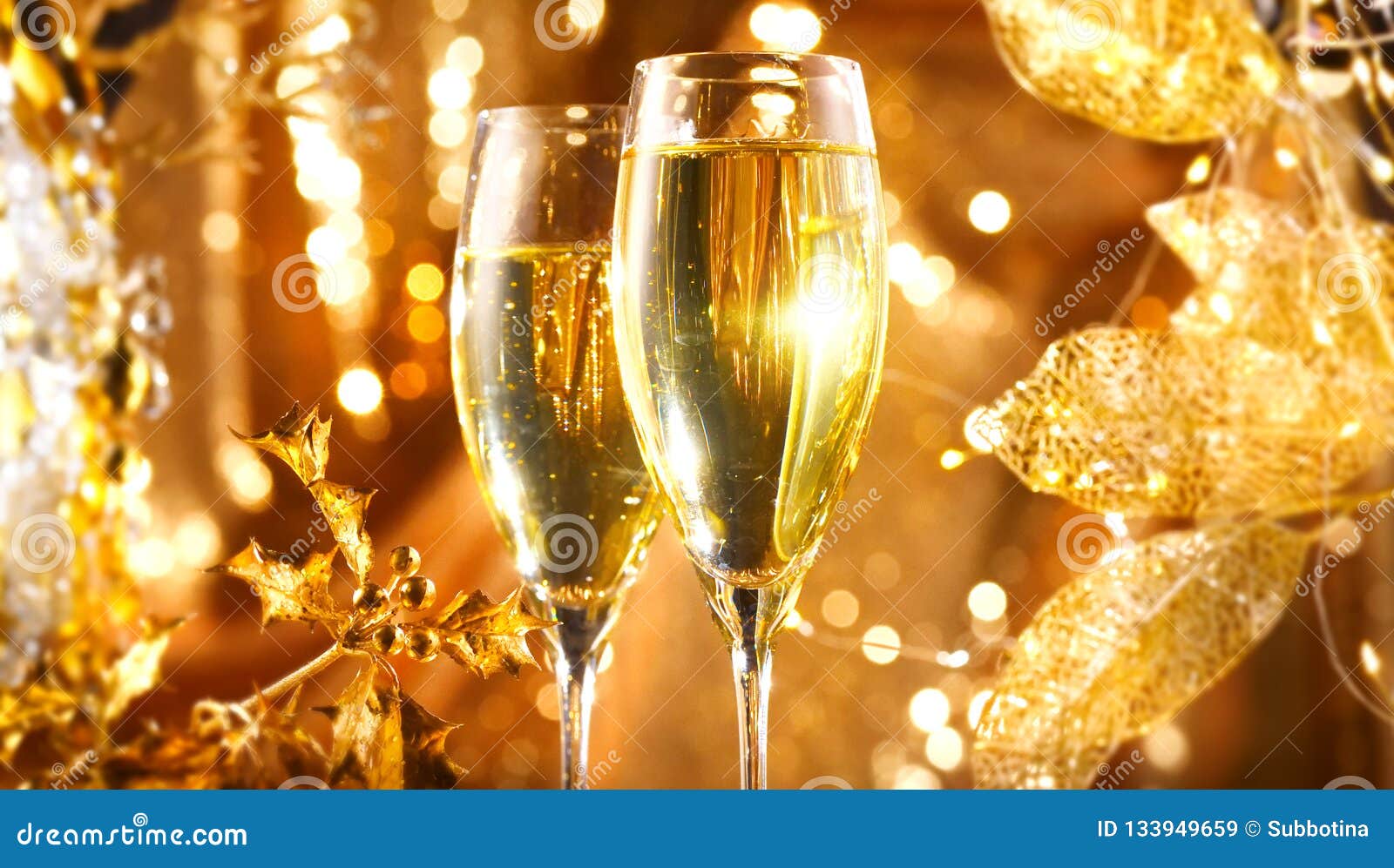 Christmas Scene. Flute with Sparkling Champagne Over Holiday Golden ...