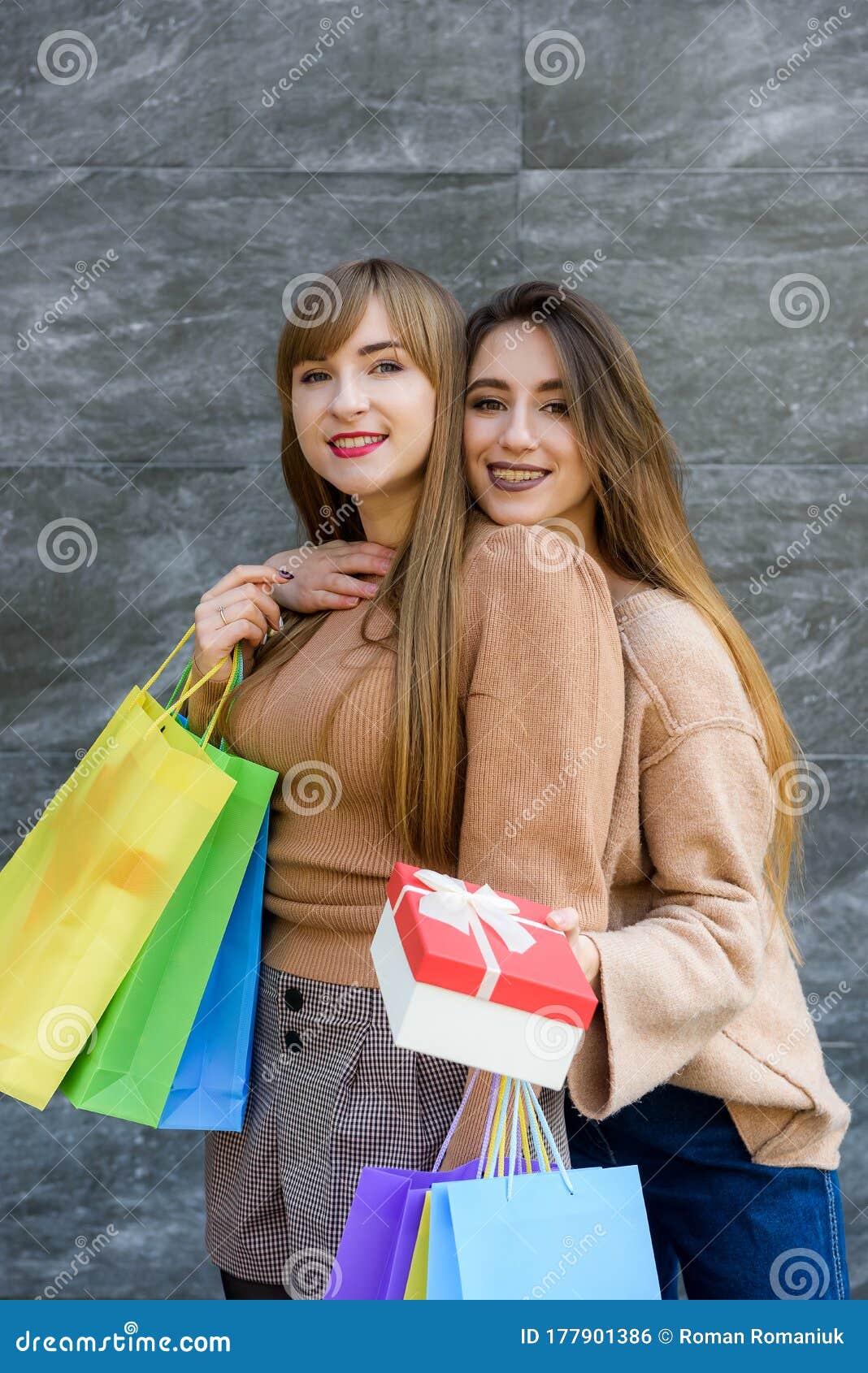 Christmas Shopping. Two Happy Women with Colorful Gift Bags Posing ...