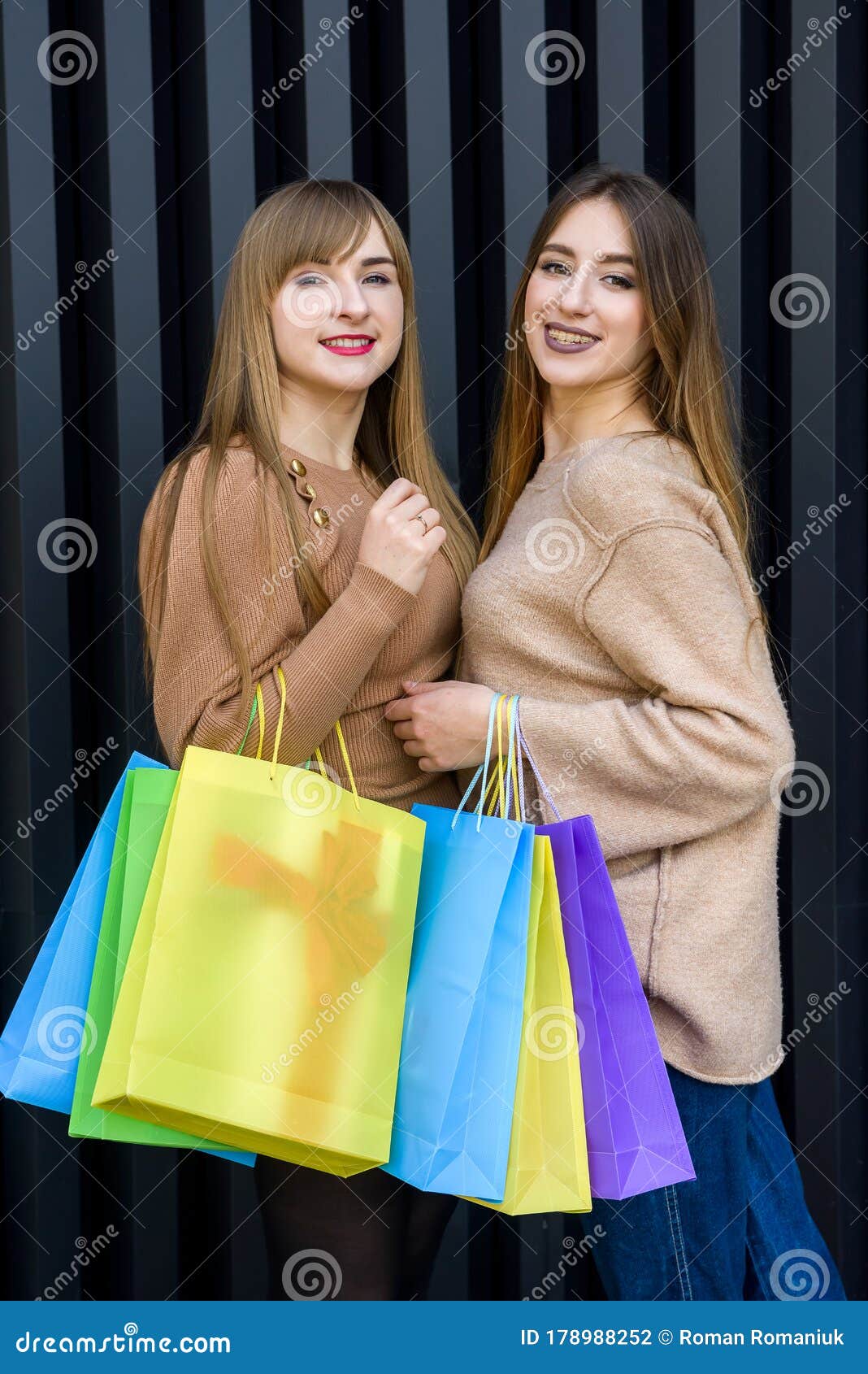 Christmas Shopping. Two Happy Women with Colorful Gift Bags Posing ...